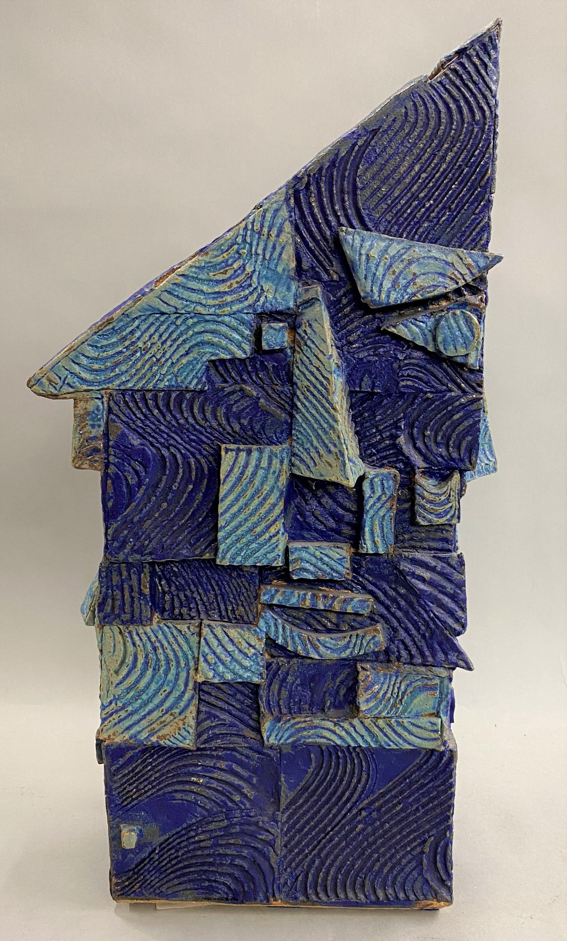 A wonderful example of an abstract ceramic or sculpture in blue, referred to as a bird house or face vase, by Indian / American artist Gerry Williams (1926-2014). Williams was born in India from American parents, and eventually set up a studio and