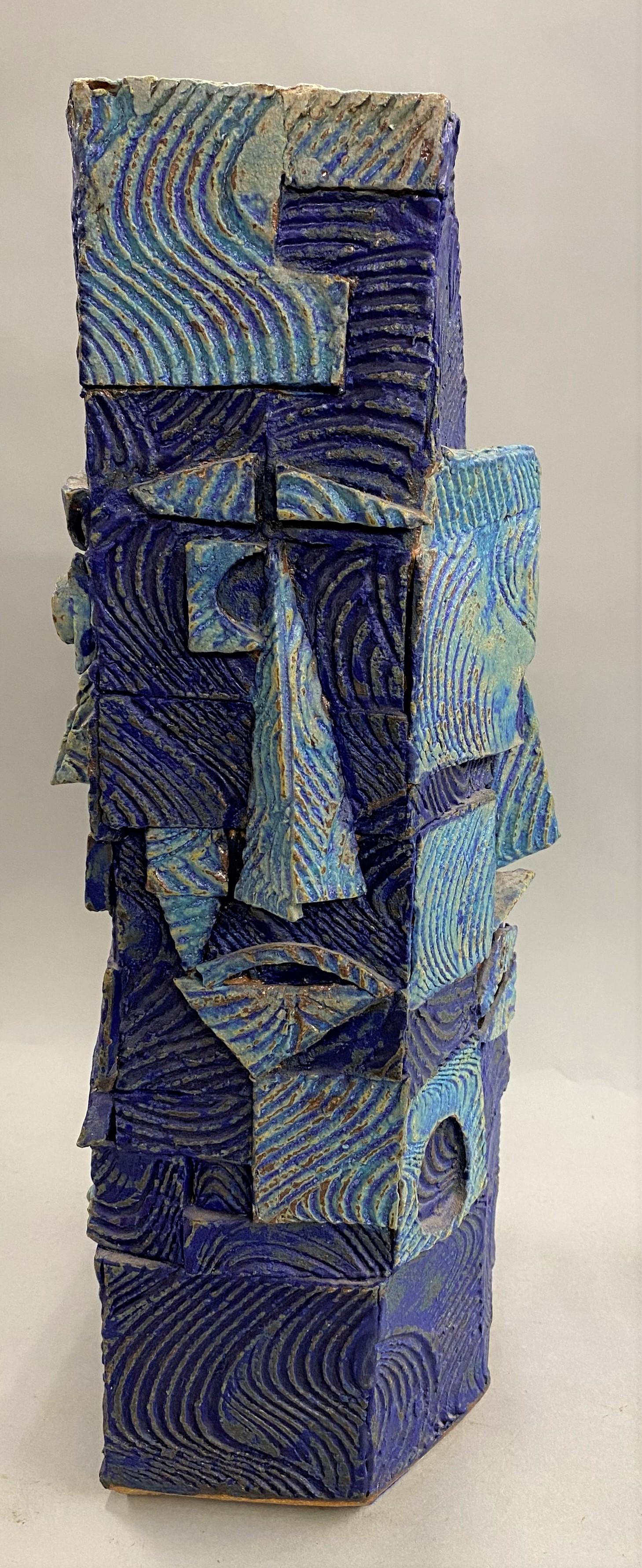 A wonderful example of an abstract ceramic or sculpture in blue, referred to as a bird house or face vase, by Indian / American artist Gerry Williams (1926-2014). Williams was born in India from American parents, and eventually set up a studio and