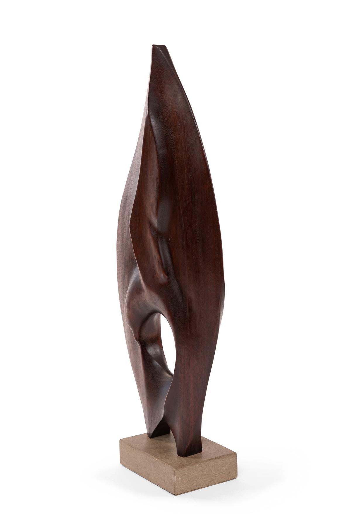 Solid walnut sculptural form by artist Gert Olsen on stone base. Signed and dated.