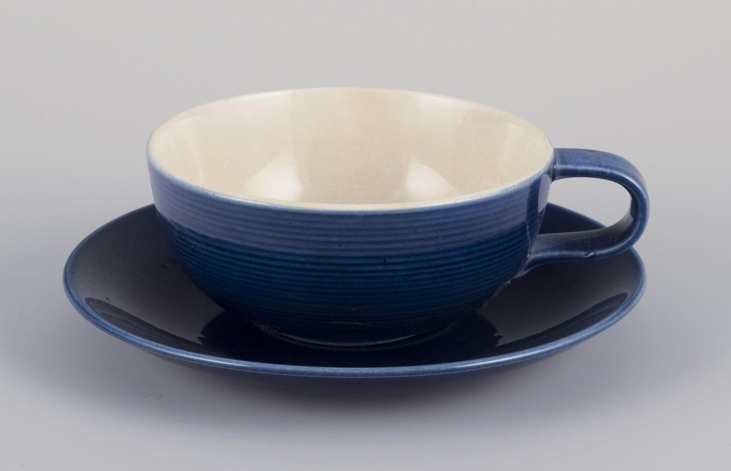 Pre-owned goods are exempt from import duties for U.S. customers. 
Therefore, no import tariffs will be applicable to your purchase.

Gertrud Lönegren for Rörstrand, Sweden.
Set of four 