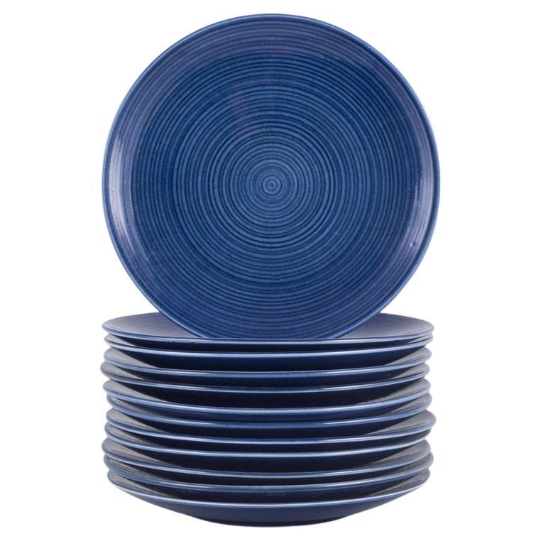 Gertrud Lönegren for Rörstrand. Set of twelve "Blå Blanche" plates in faience.
