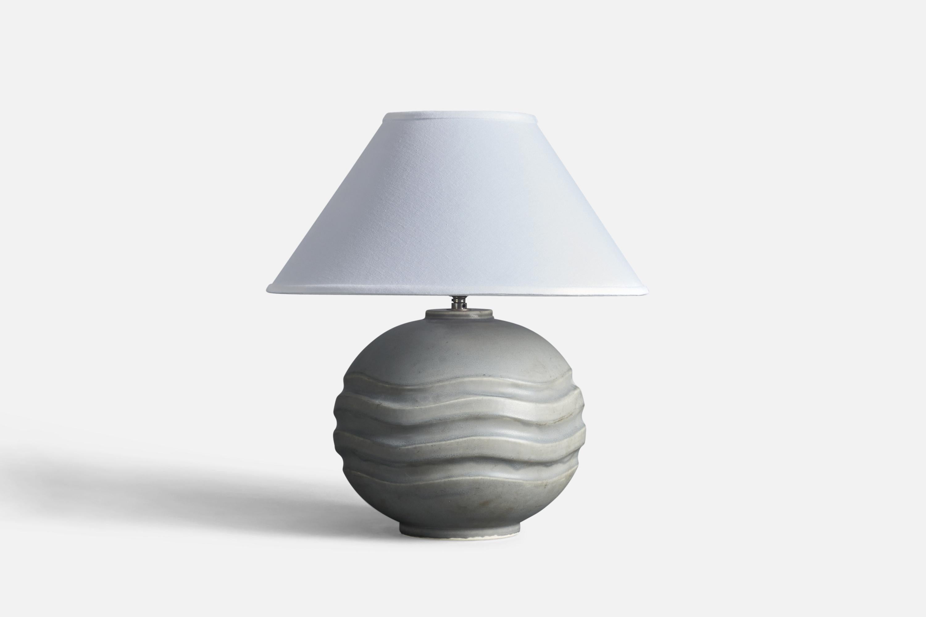 A grey glazed stoneware table lamp designed by Gertrud Lönegren and produced by Rörstrand, stamped, Sweden, 1950s.

Sold without the lampshade. Stated dimensions excluding lampshade but including original mounting for lampshade.

Socket takes