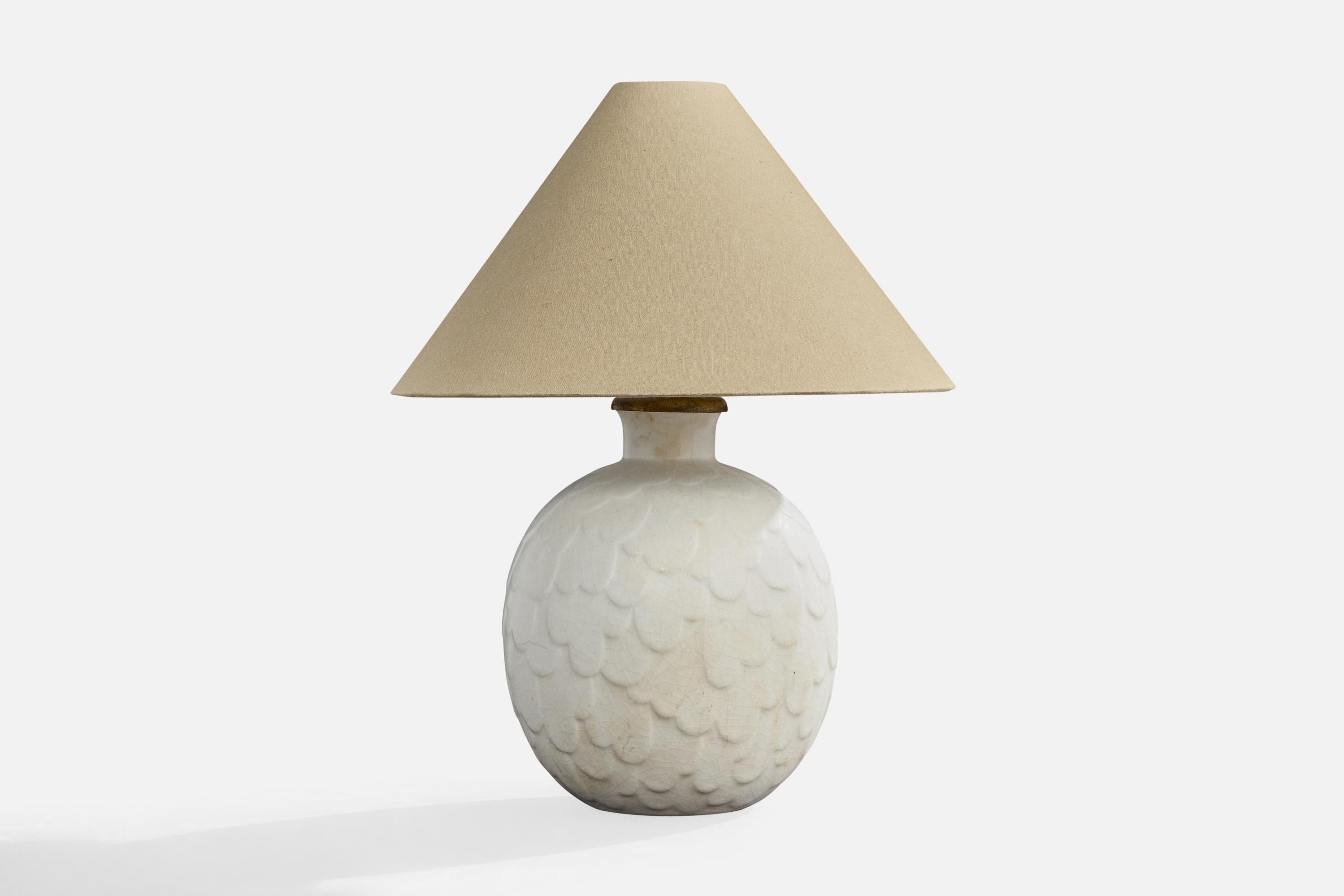 A white glazed stoneware, brass and beige fabric table lamp designed by Gertrud Lönegren and produced by Rörstrand, Sweden, c. 1940s.

Dimensions of Lamp with Shade (inches): 15.5
