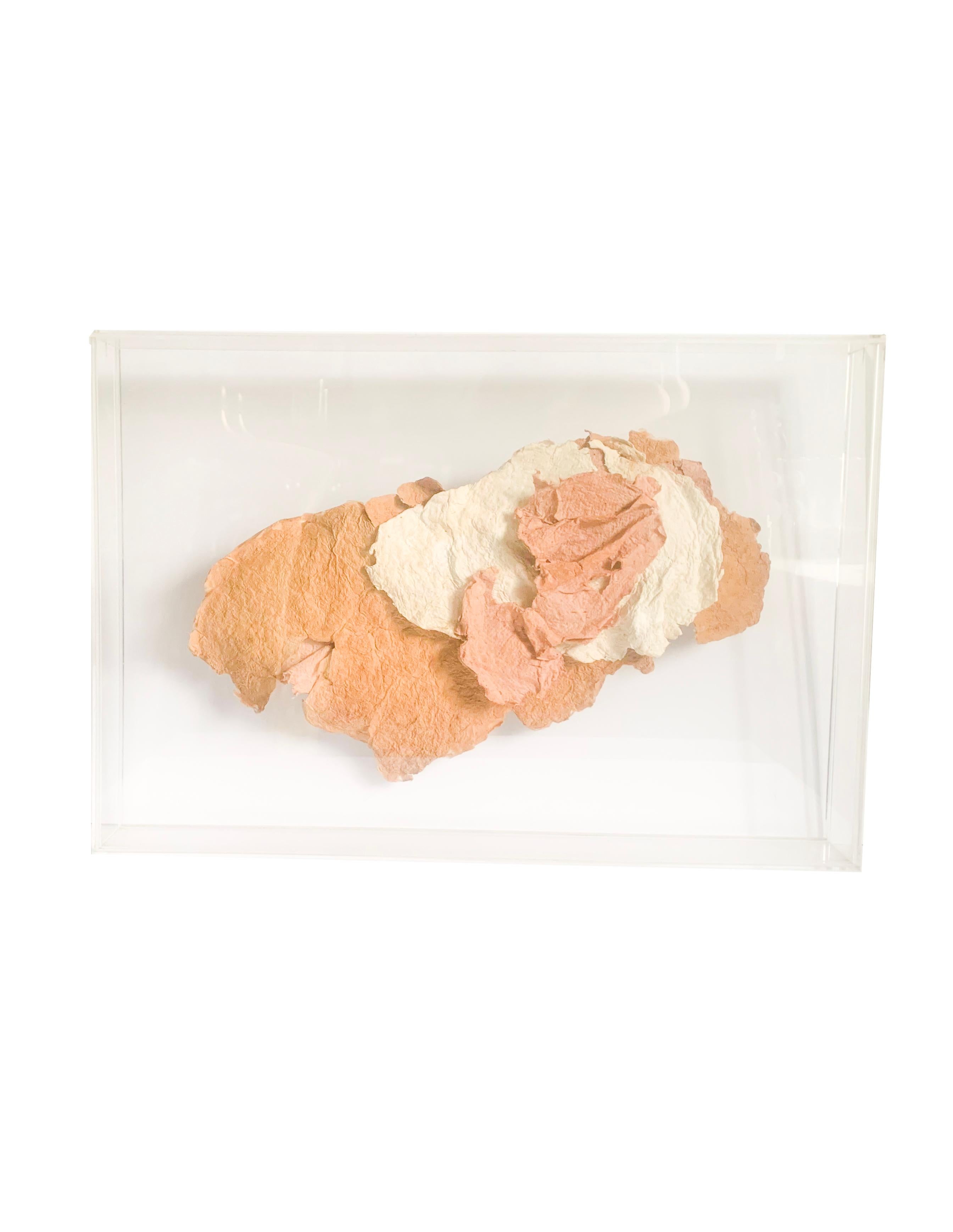A 1970 - 1980’s handmade paper assemblage by regionally (Northeast USA) known artist Gertrude Simon. This colored handmade paper sculpture by the artist sits within an acrylic floating frame.

About the artist:

Gertrude Simon has been mentioned