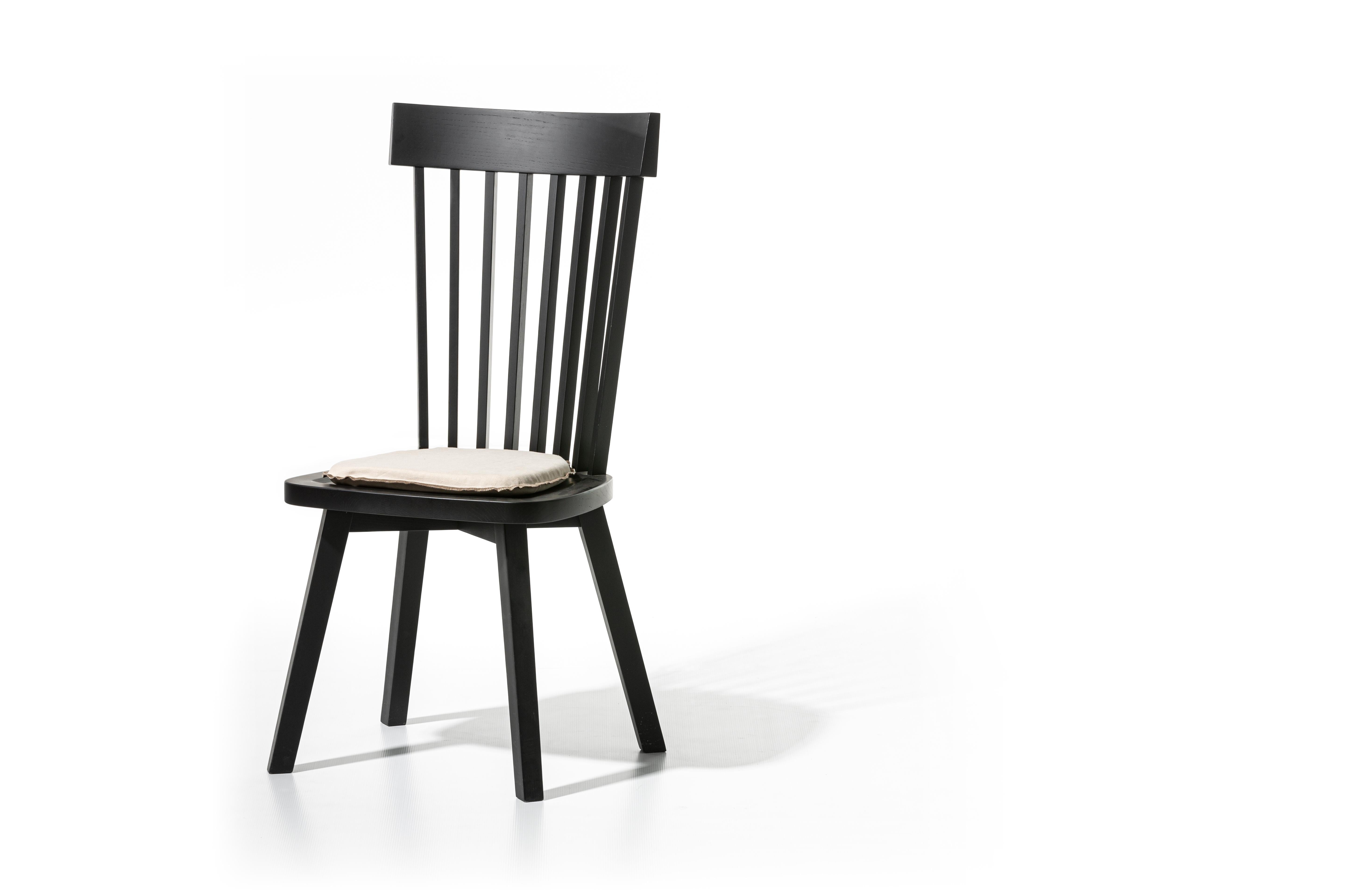 Single-material chair with high backrest and visible vertical slats without armrests, Gray 21 is characterised by clean and essential lines, with the structure in natural painted Canaletto walnut, bleached oak or white, grey, black, ocean or