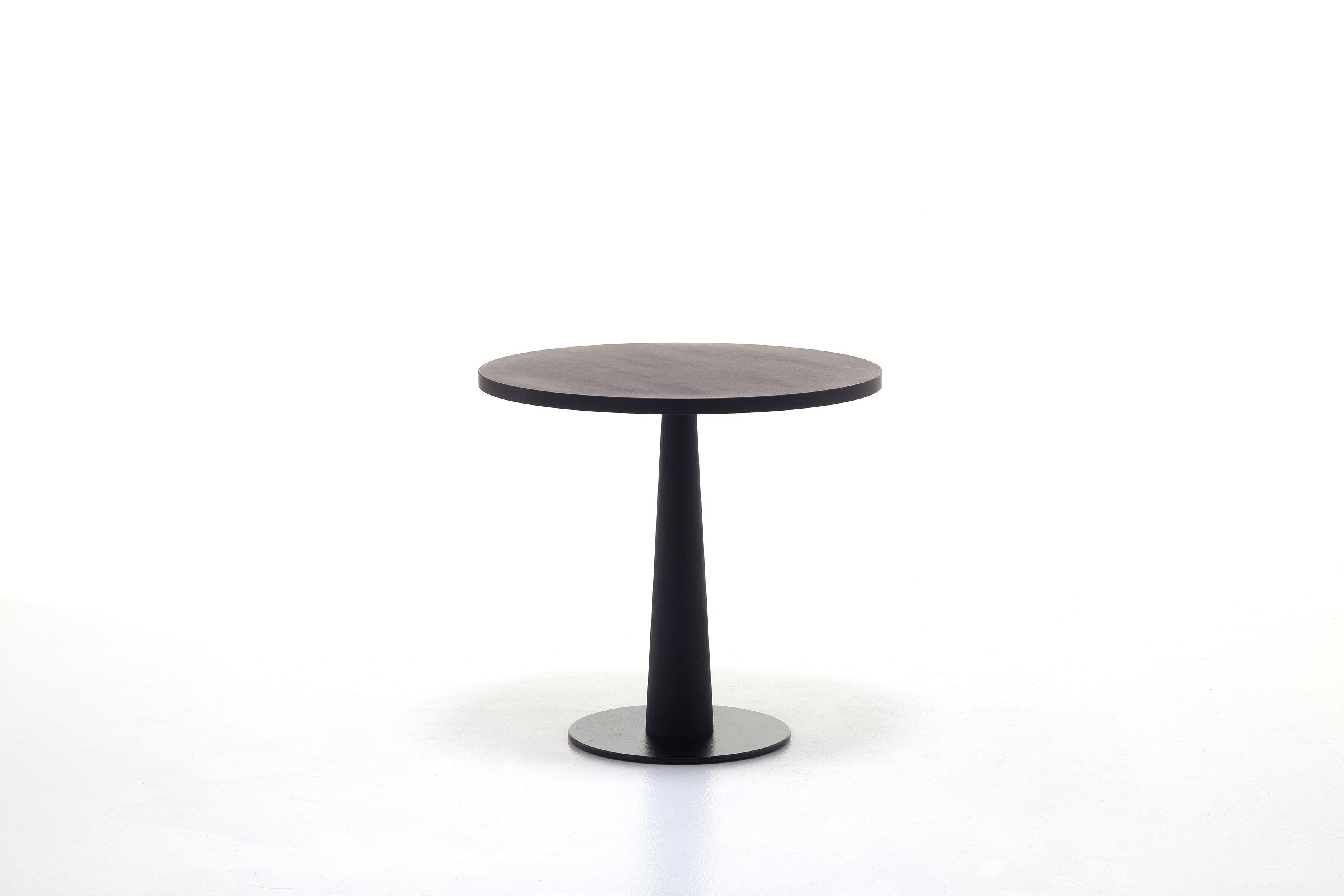 Gray 39 is a table with a round top, defined by the combination of natural painted solid Canaletto walnut; white, grey, black, ocean or dove-grey lacquered wood used for the top and the column leg.

Table, central base in black cast iron, column