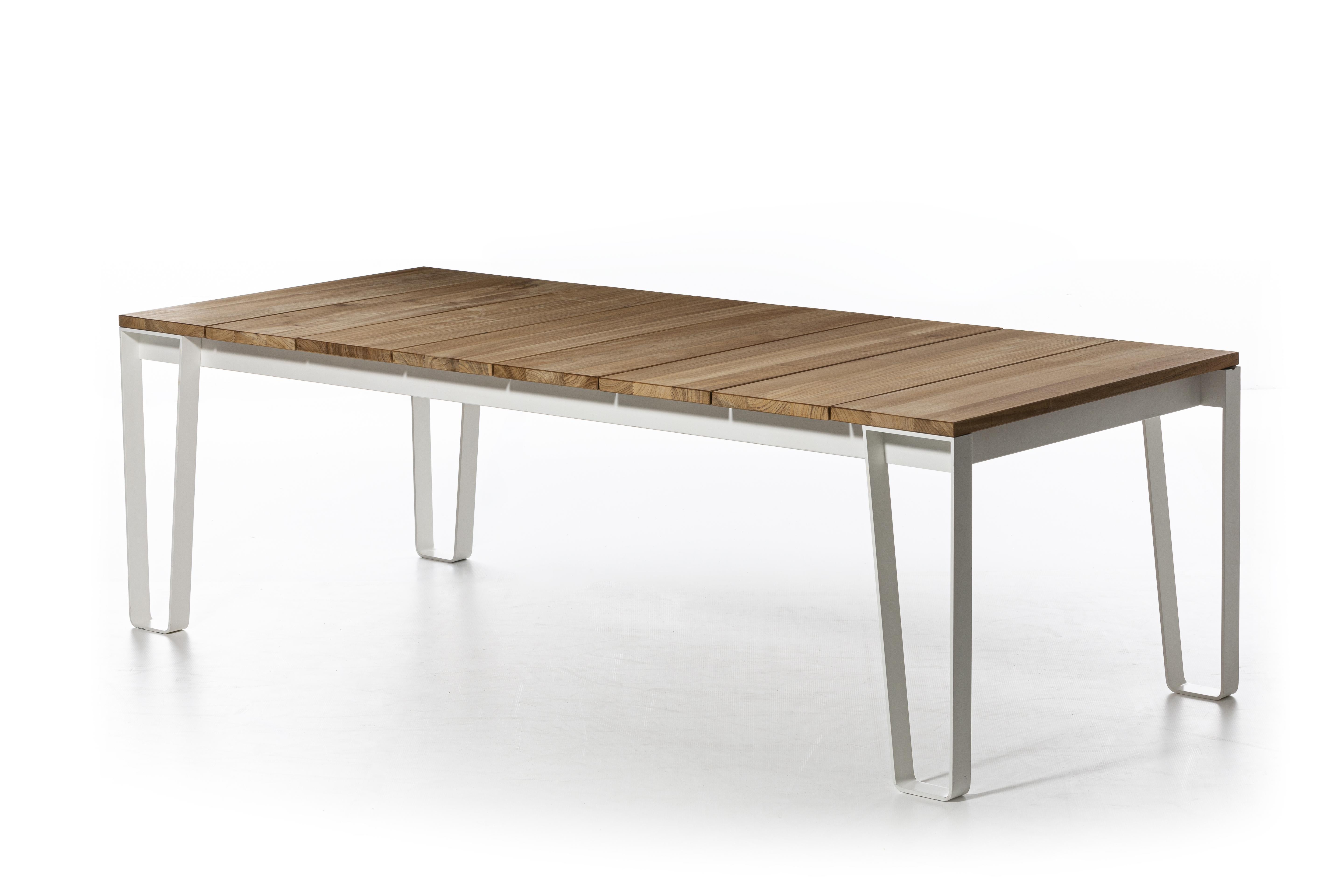 Family of tables with rectangular top available in two sizes, Inout 933/938 express a refined Nordic minimalism. Four-legged tables, they have the structure and legs made in matt white, grey or sage painted steel that, folding on itself, draw the