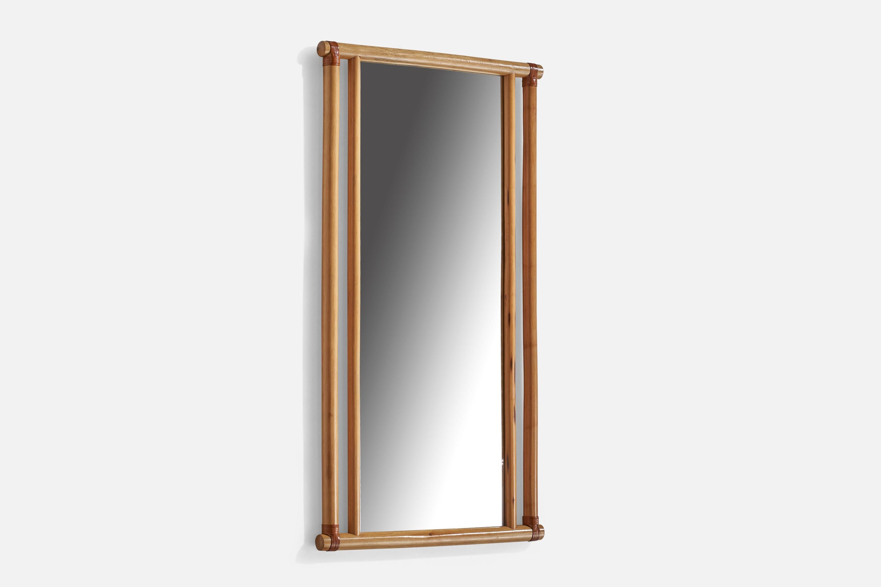 A light wood and brown leather mirror designed and produced by Gervasoni, Italy, c. 1970s. 

Mirror with makers mark branded to backside.