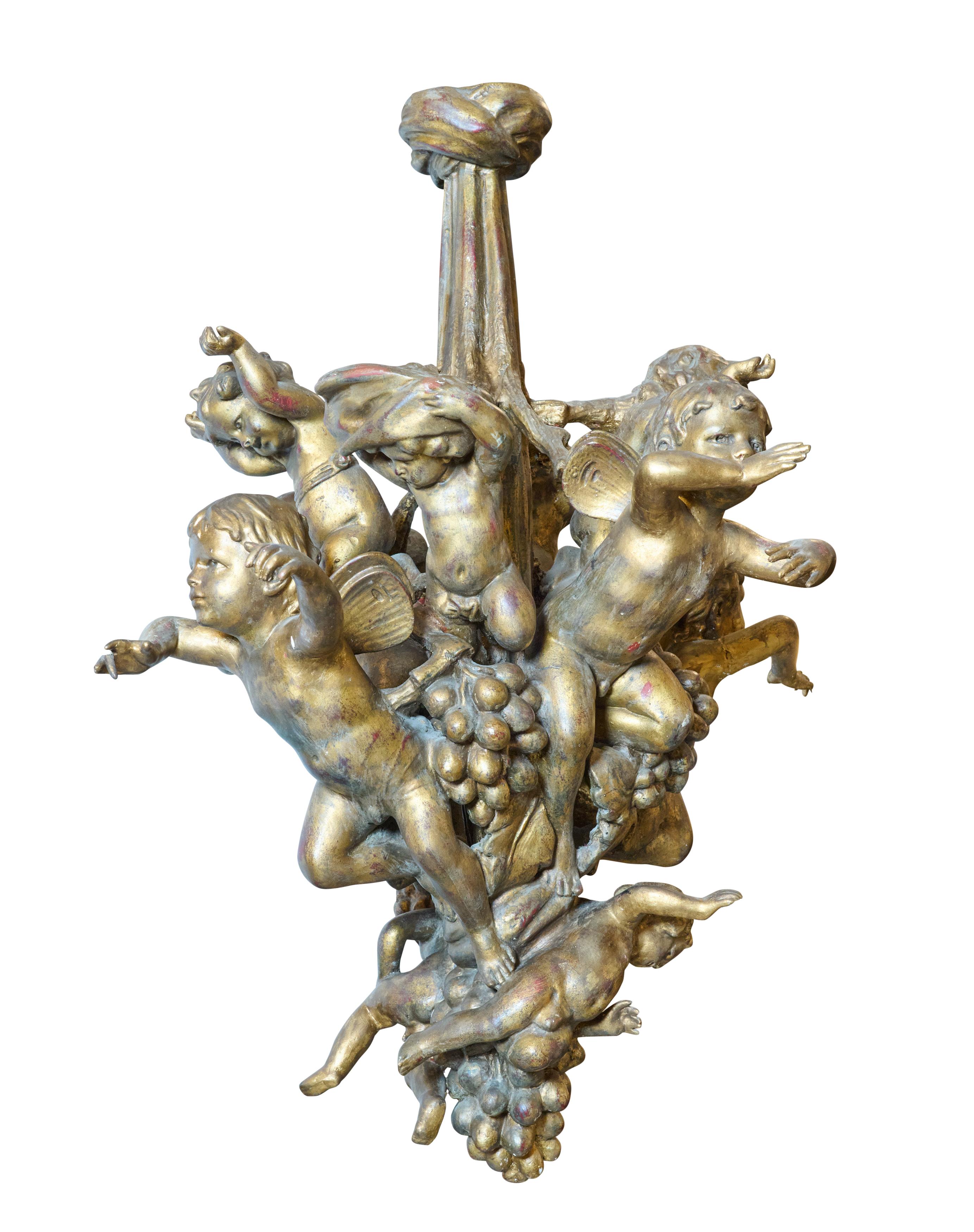 The best gesso and gold leaf chandelier with putti. Bought in Buenos Aires. Great patina.