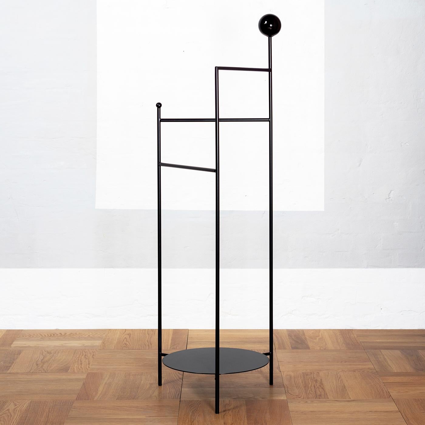 Gestus Valet Stand by OK Design
Dimensions: D 33.5 x W 40 x H 125.5 cm.
Materials: Powder-coated metal.

Available in black, or white. Please contact us.

Gestus Valet is a clothes stand that organizes your clothes in a beautiful way. Use it to hang