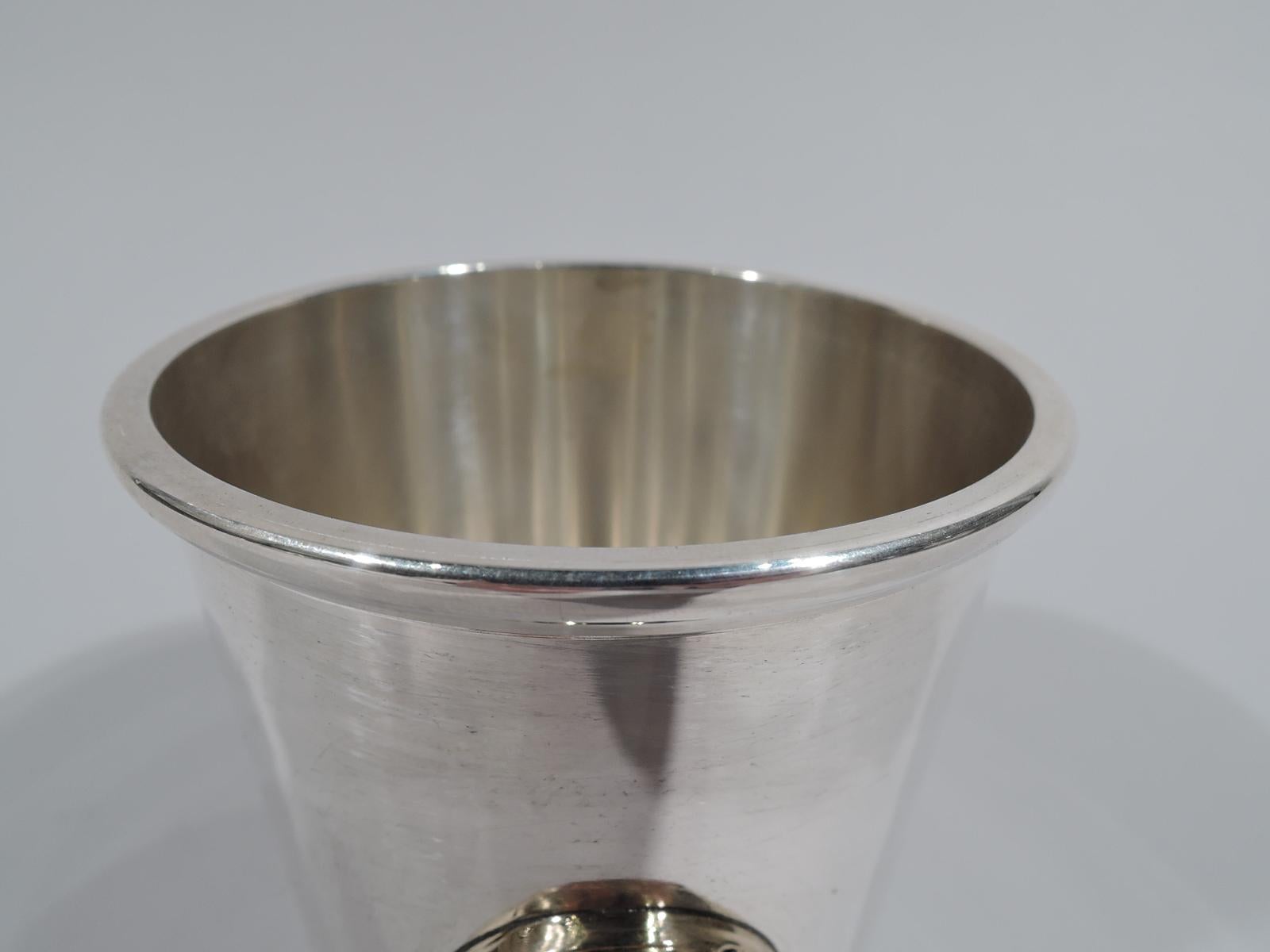 Official sterling silver mint julep cup for Kentucky Derby. Straight and tapering sides with tooled floral border at vase. Gilt horseshoe applied to front. Marked: Official / Kentucky Derby / Mint Julep Cup / Sterling / BWK. Weight: 5.5 troy ounces.
