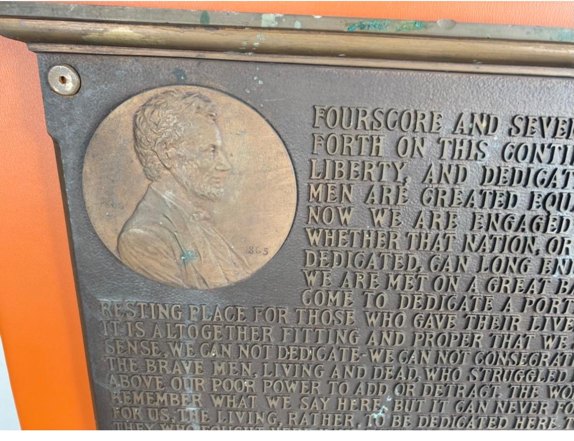 Seldom seen large rectangular bronze plaque with the text of Abraham Linciln's Gettysburg Address in raised lettering..Upper left hand corner ,,seperate cast ,4-1/4 circular medallion with profile bust of Lincoln.. Top edge has molder cornice and