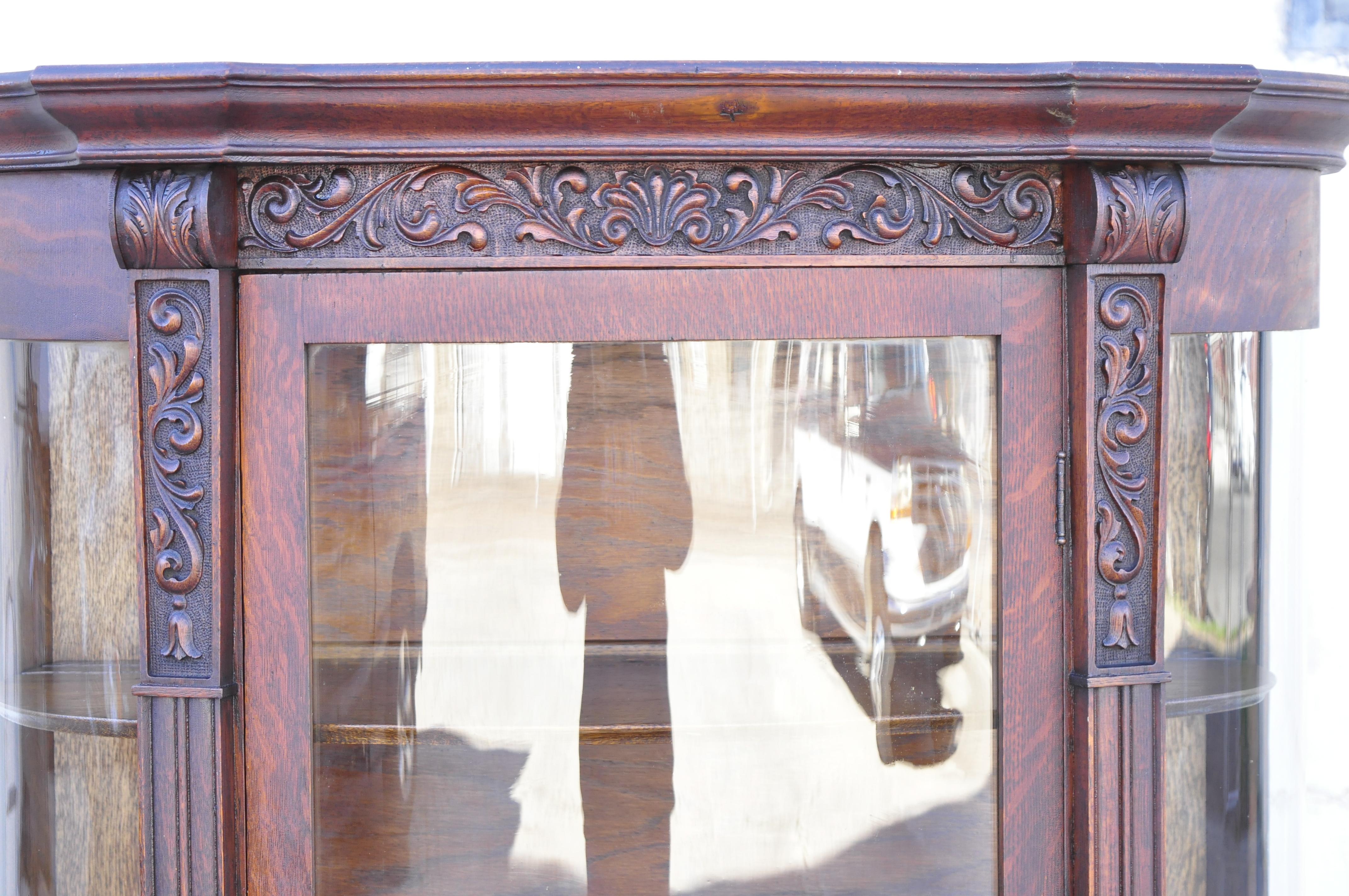 Antique American Empire tiger oak bow glass paw feet china cabinet curio by Gettysburg Furniture Company. Item features bow glass front and sides, carved paw feet, beautiful wood grain, nicely carved details, no key, but unlocked, very nice antique