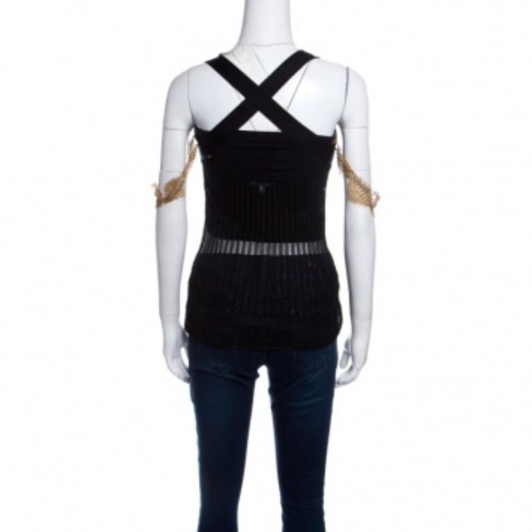 Le cinghie di pizzo aggiuntive, la tinta unita nera e il motivo traforato di questo top GF Ferre rendono questo top un modello stellare. È progettata con spalline sottili che si incrociano sul retro ed è realizzata in misto nylon. Questo modello