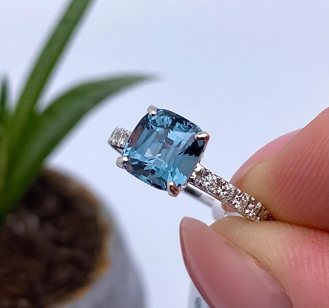 Ring With Natural Blue Spinel and Diamonds gemstone
14 Karat White Gold Ring

Laboratory full certificate for the ring.
Tourmaline have own certificate GFCO
Main Stone: Spinel
Main Stone Creation: Natural
Main Stone Color: blue
Main Stone Origin: