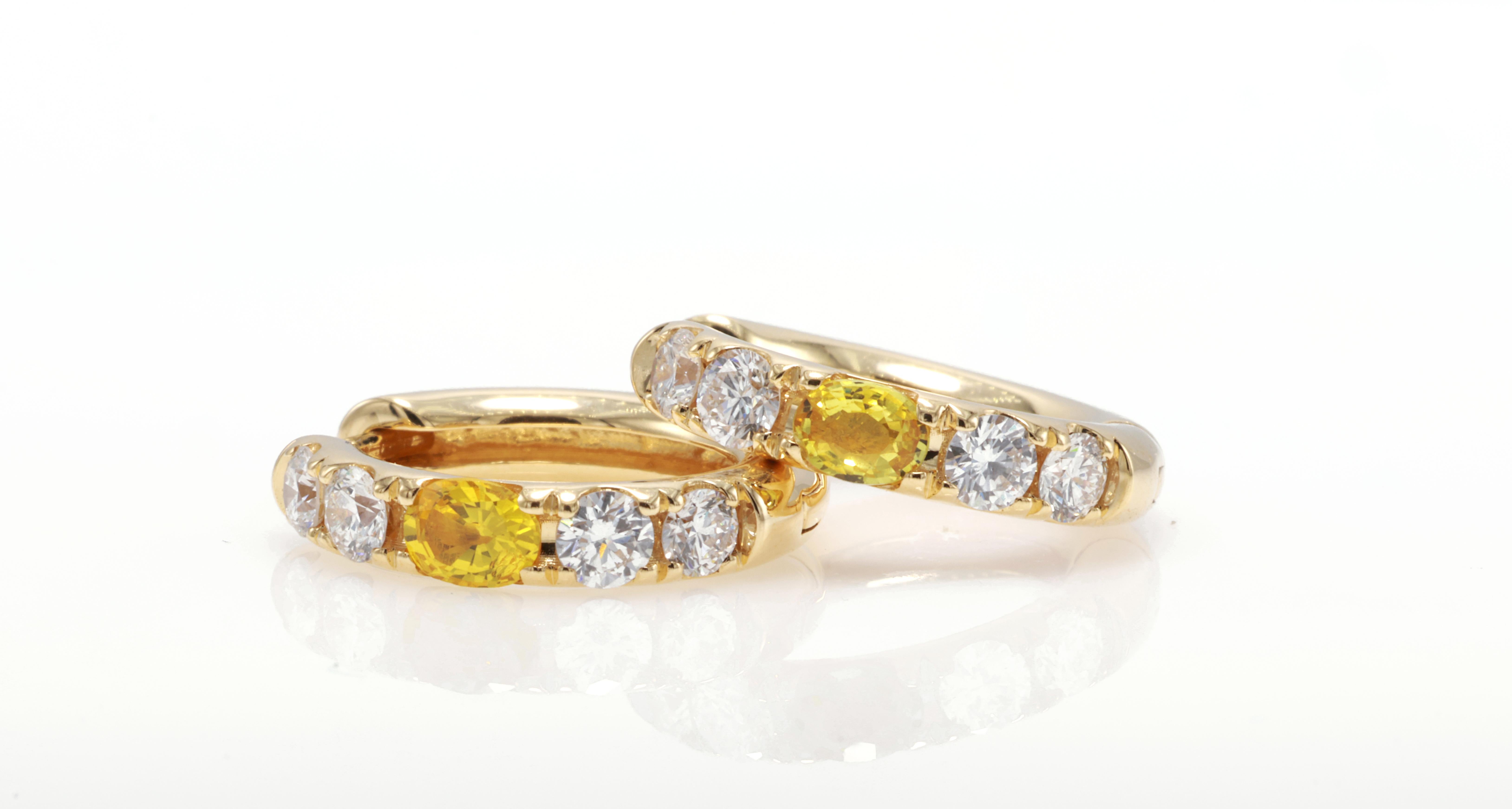 18kt white gold earring with diamonds
  
  Gold colour & karat: White gold 18kt
  Weight: 4.585 grams
  
  Set with-
  Stone type: Sapphire
  Shape: Oval
  Carat: 0.37 (02 Pcs ) 
  Colour: Yellow
  Clarity: -
  
  Surrounding Stones: Diamonds
 1)