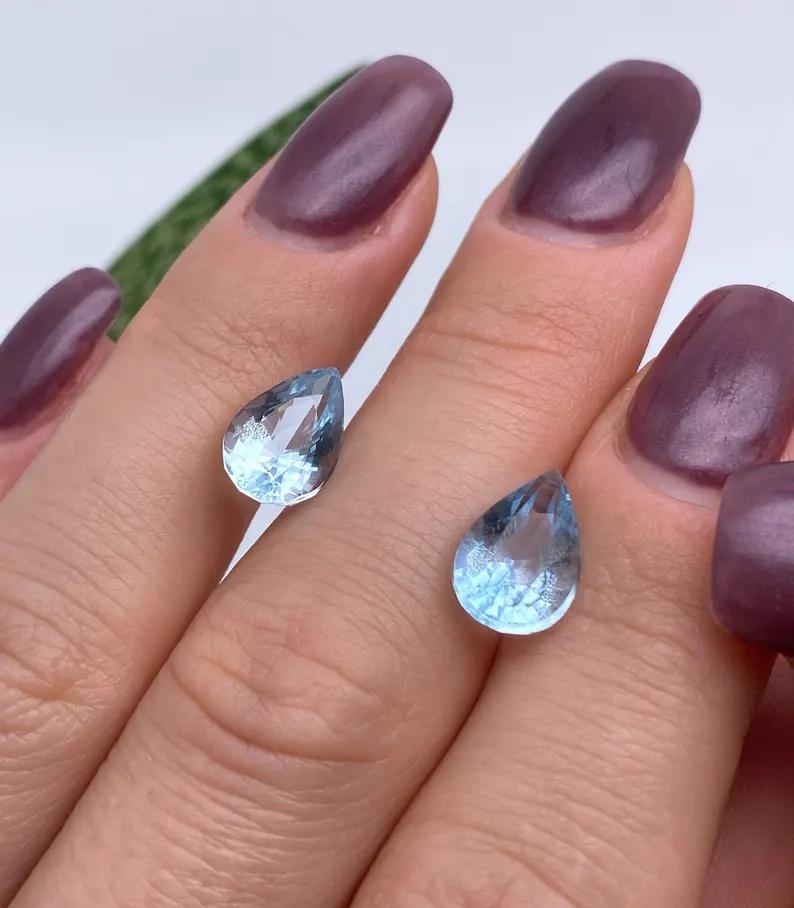 Natural Pair of Aquamarine gemstones

Certificate GFCO
Gemstone Color: Blue
Gemstone Type: Aquamarine
Gemstone size: 11.78x7.98x6.08mm and
11.69x7.83x6.16mm
Cut Grade: Very Good
Gemstone Shape: Pear cut
Gemstone Creation: Natural
Gemstone Treatment: