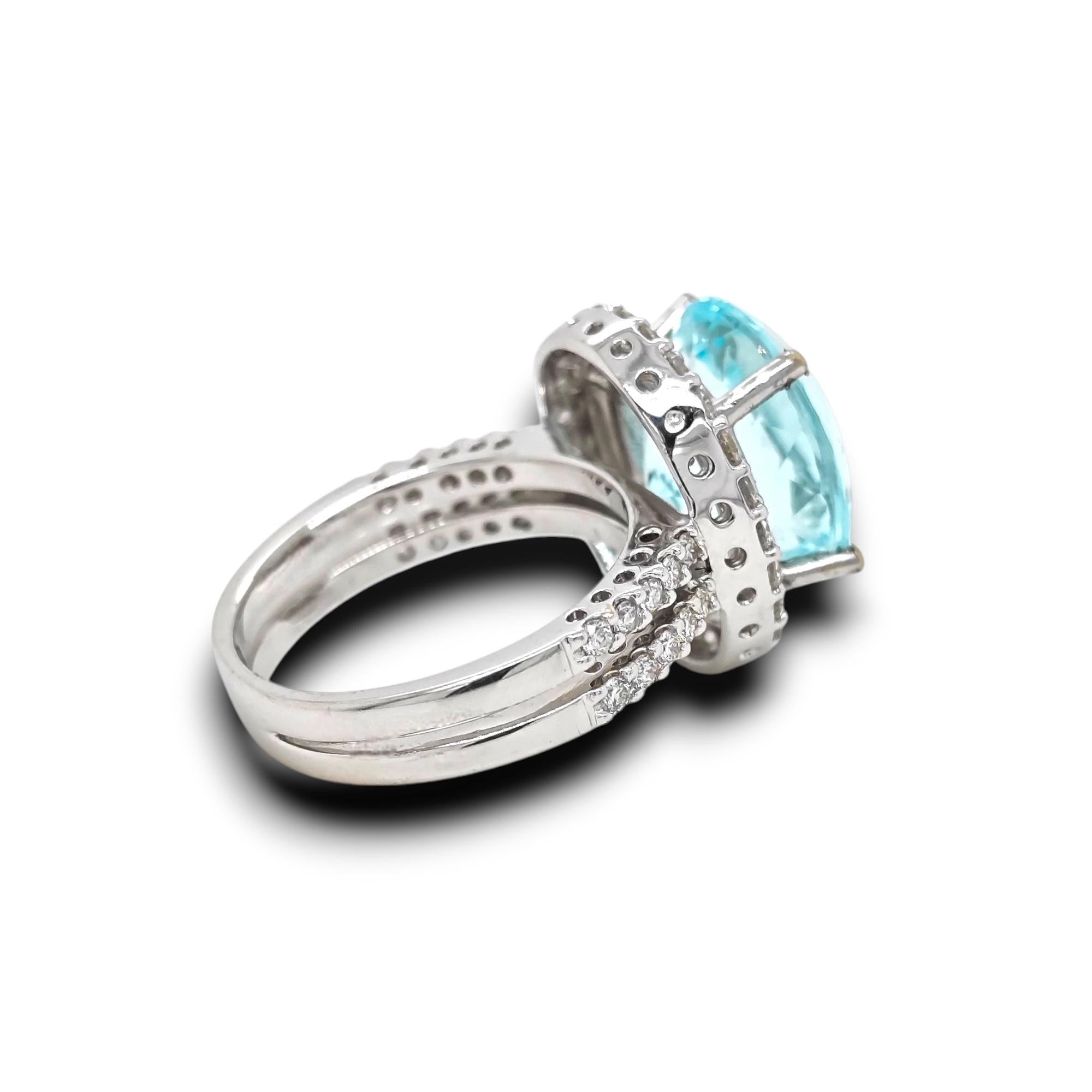 1 Gema de Turmalina Paraiba: 7,69 Quilates
44 Diamantes Blancos Redondos: 0,79 Quilates
Metal: Oro blanco de 18 quilates, 7,30 gramos

GFCO Labretory GEM: AAP54656