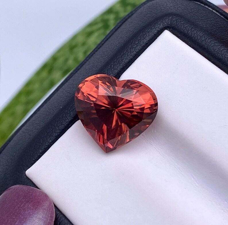 Natural Tourmaline gemstone

GFCO Laboratory certified
Gemstone Color: Orange-Pink
Gemstone Type: Tourmaline
Gemstone size: 12.26x13.43x9.67mm
Cut Grade: Very Good
Clarity/Grade: VS
Gemstone Shape: Heart cut
Gemstone Creation: Natural
Gemstone
