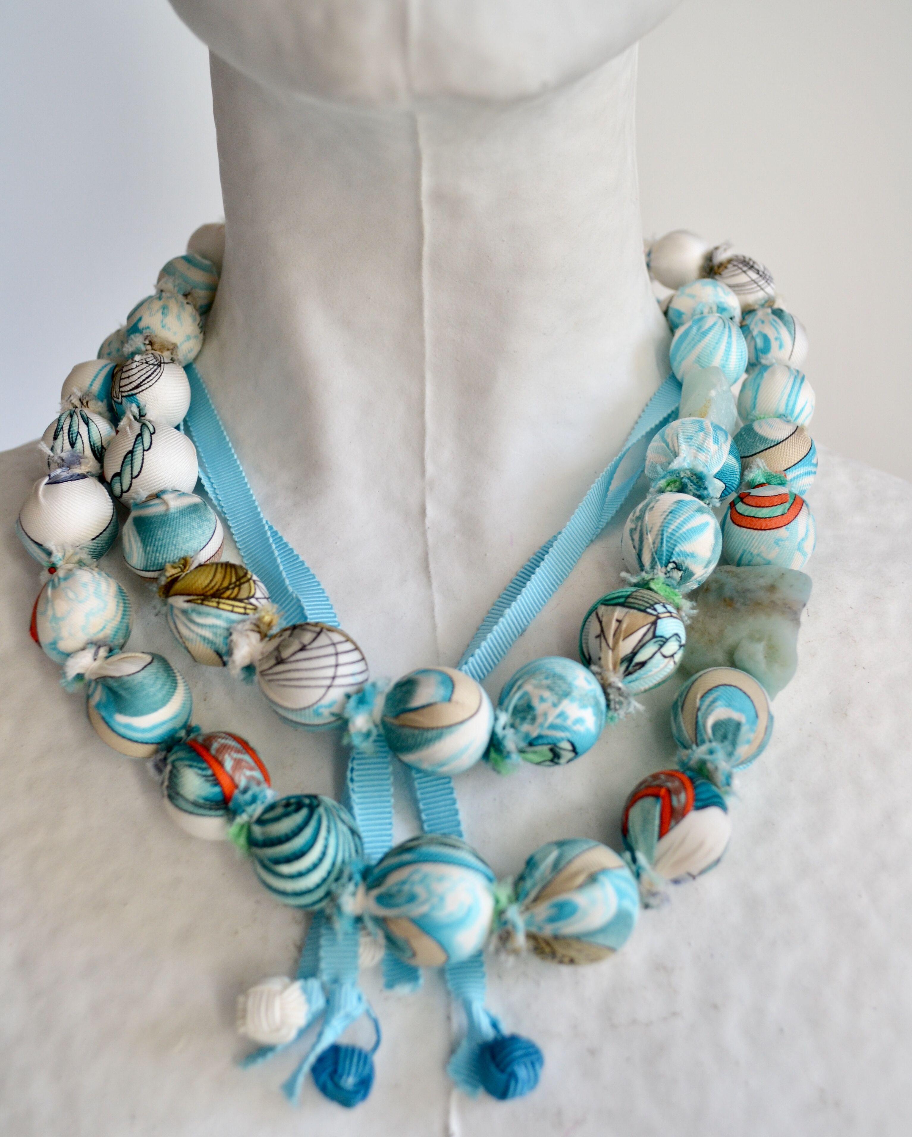 One of a kind double row bead necklace hand wrapped with authentic vintage silk Hermes scarves. Semi precious stones throughout. Made by Gordana Gasparovic. Adjustable length.
