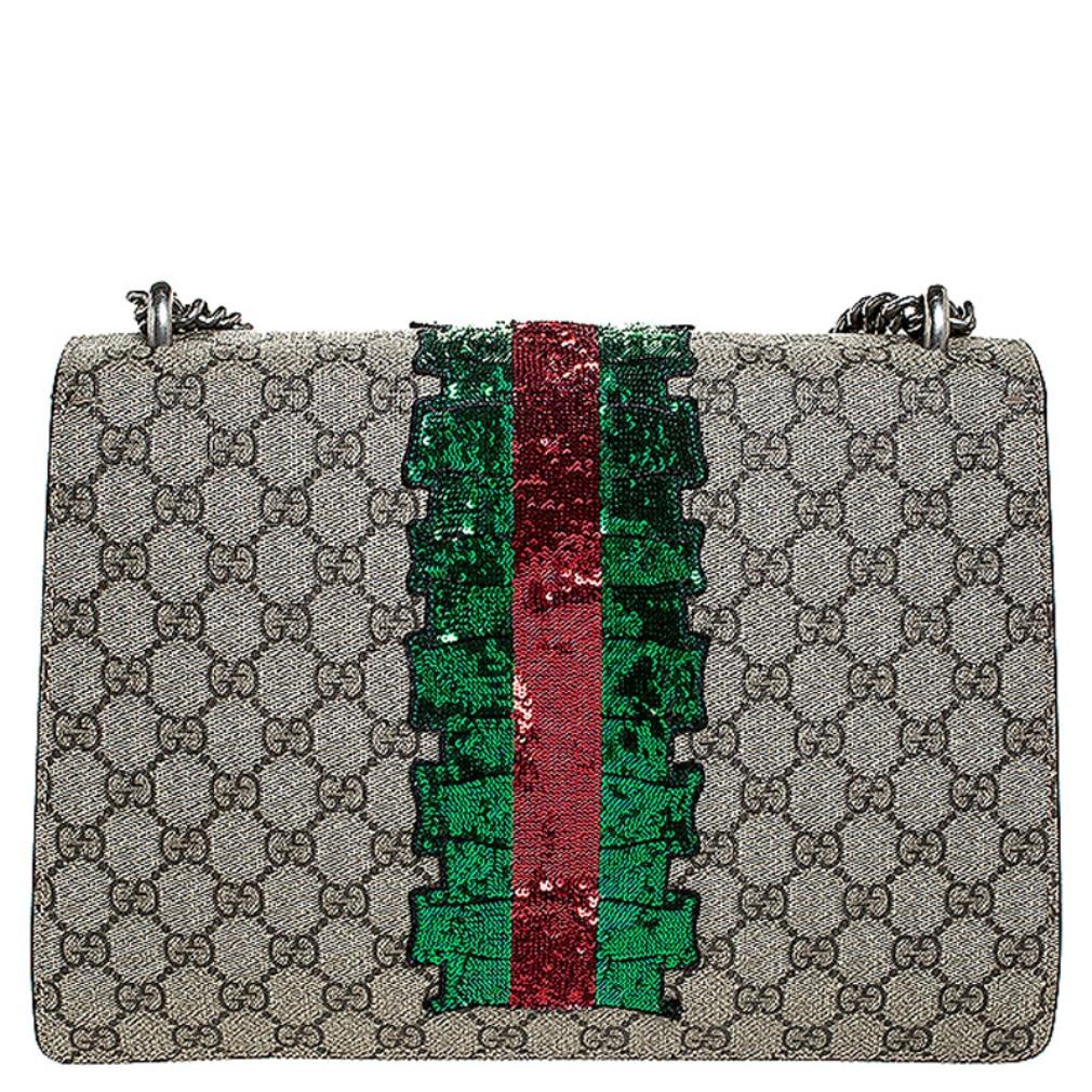 This gorgeous bag will not only complement all your outfits but fetch you endless compliments. This Gucci creation has been beautifully crafted from GG Supreme canvas and styled with a flap that has sequin and crystal embellishments and a tiger head