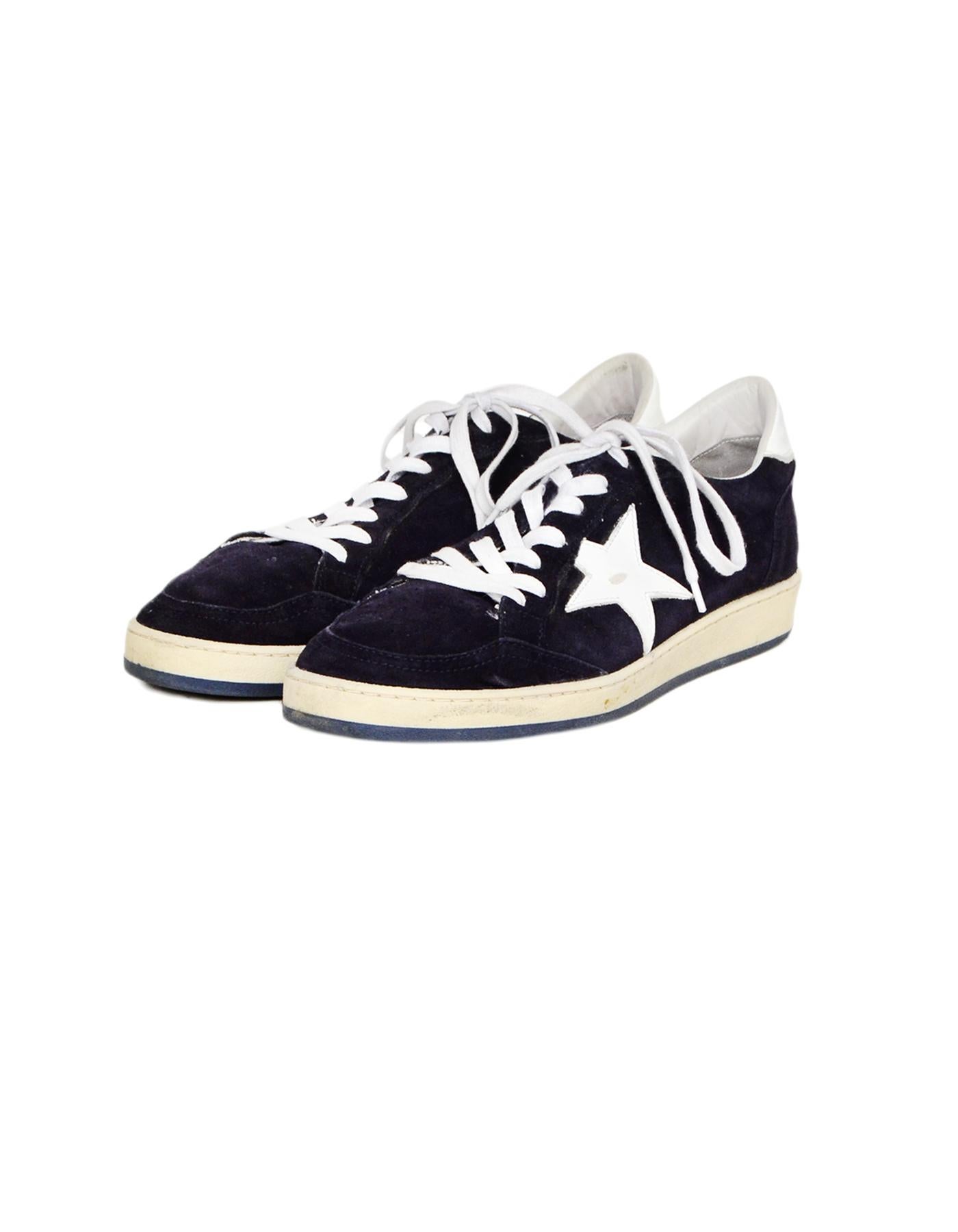Golden Goose Deluxe Brand GGDB Navy Suede/White Leather Low-Top Ballstar Sneakers Sz 41

Made In: Italy
Color: Navy/white
Materials: Suede, leather, rubber
Closure/Opening: Lace up front
Overall Condition: Very good pre-owned condition with