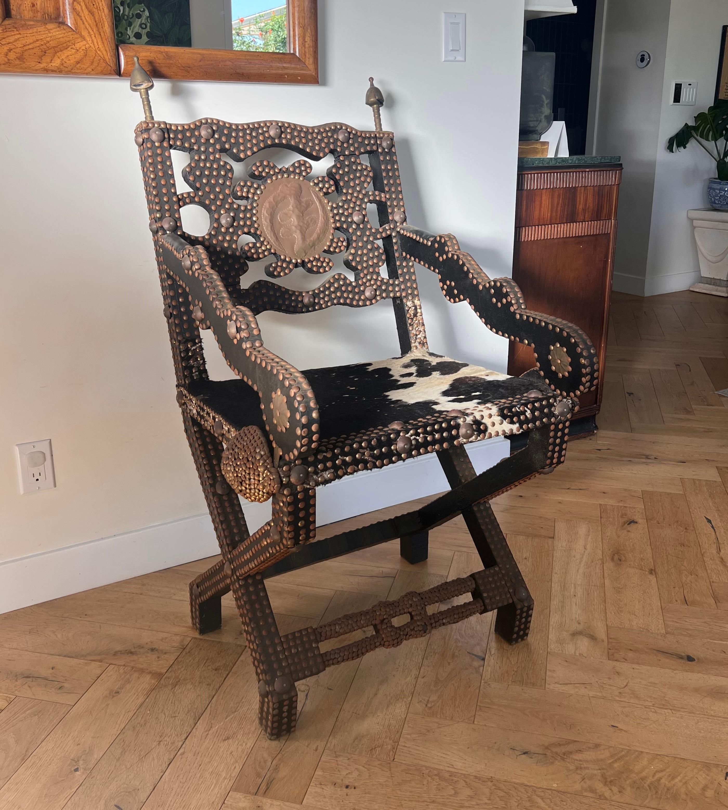 Ghanaian wood, iron, and cowhide chair, early 20th century For Sale 5