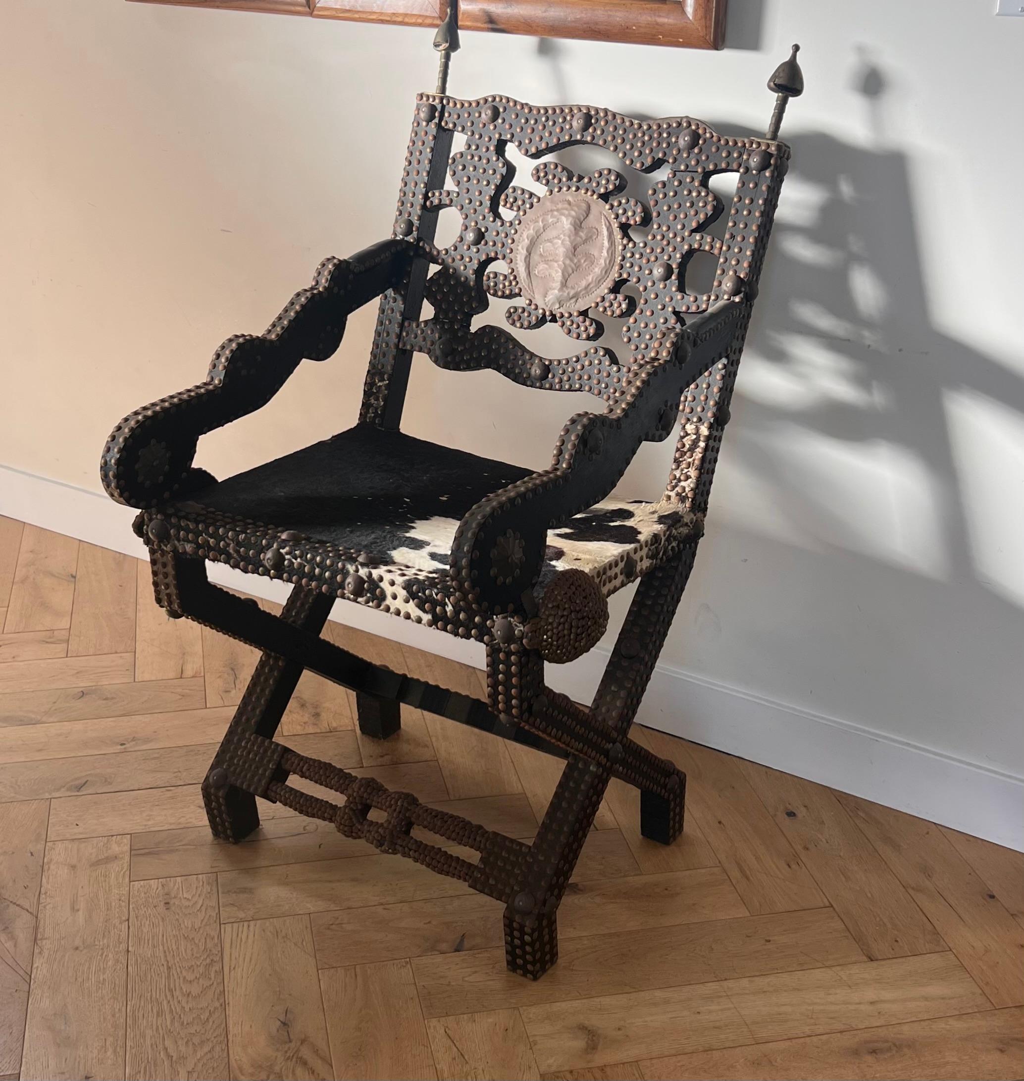 Ghanaian wood, iron, and cowhide chair, early 20th century For Sale 6