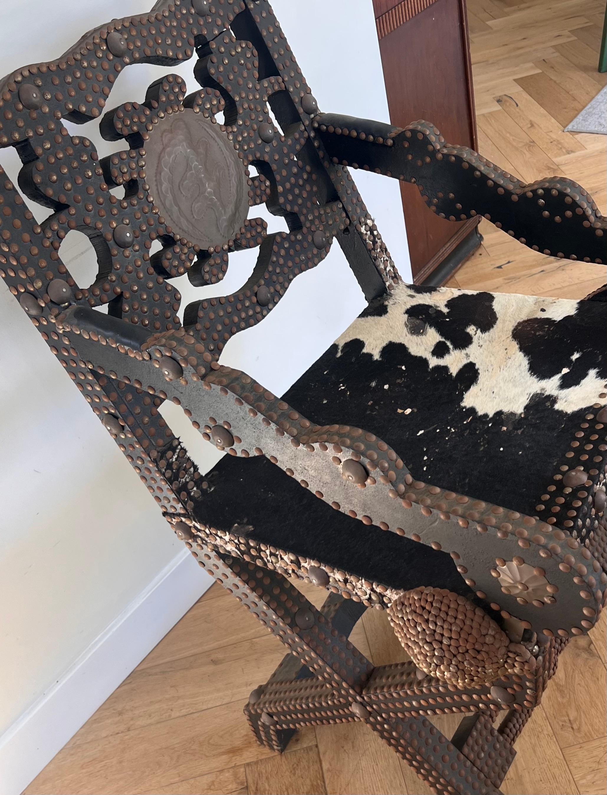 Ghanaian wood, iron, and cowhide chair, early 20th century For Sale 7