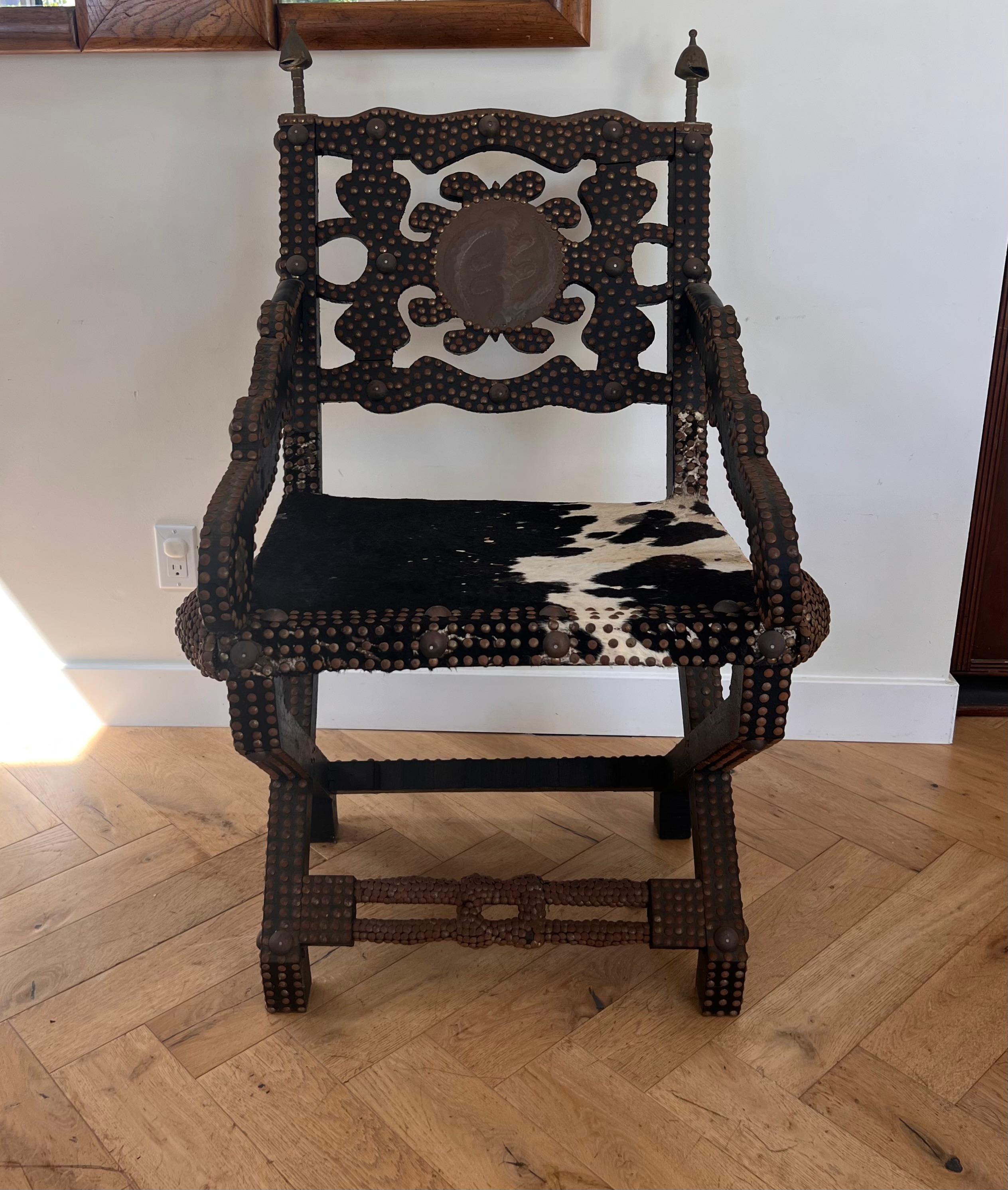 Ghanaian wood, iron, and cowhide chair, early 20th century For Sale 11