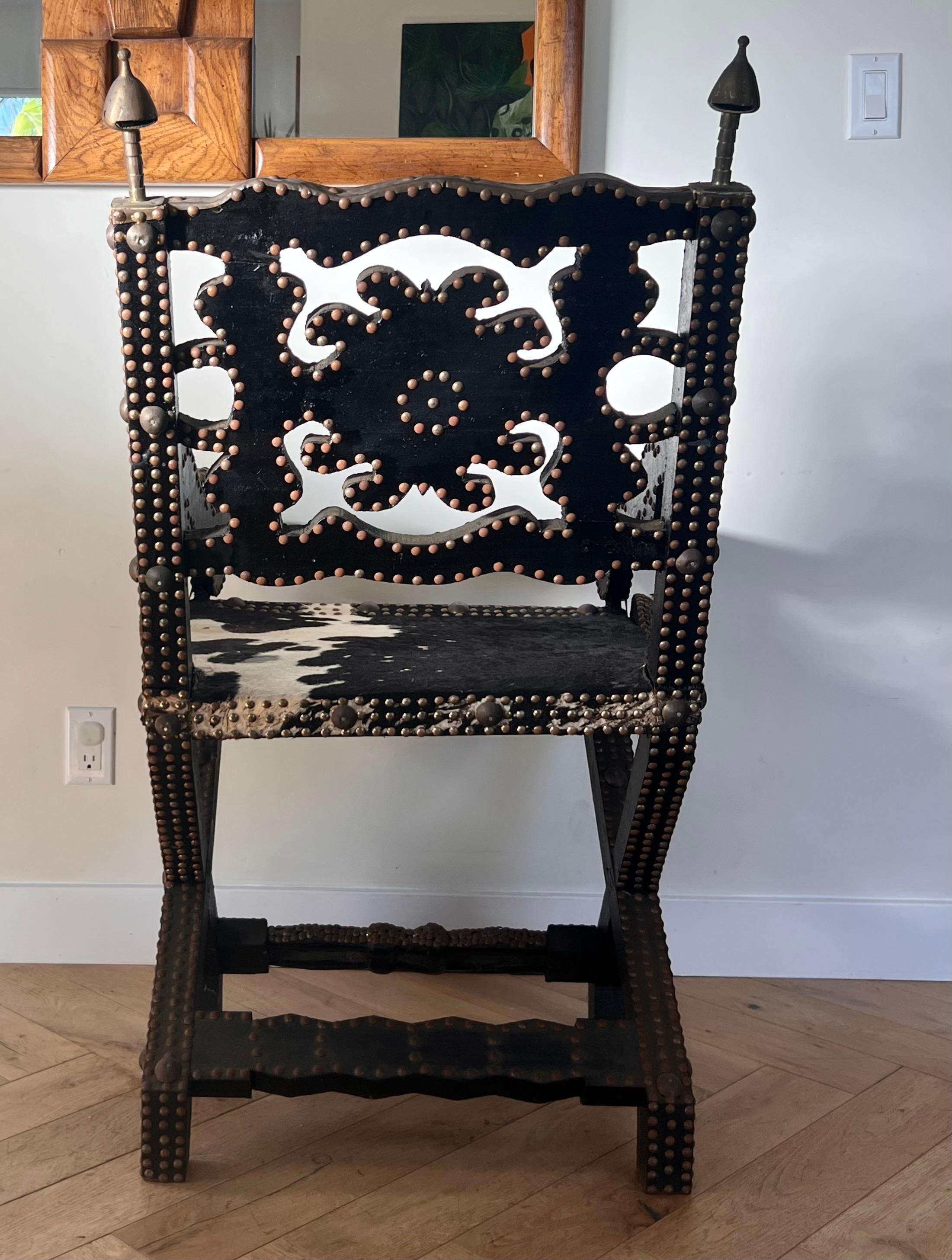 Ghanaian wood, iron, and cowhide chair, early 20th century For Sale 12