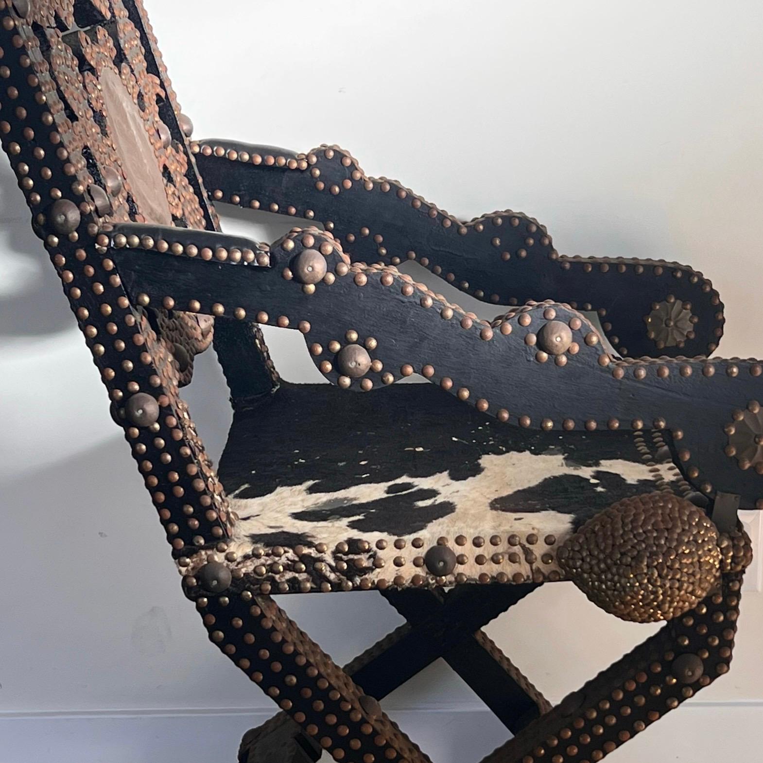 Ghanaian wood, iron, and cowhide chair, early 20th century For Sale 14