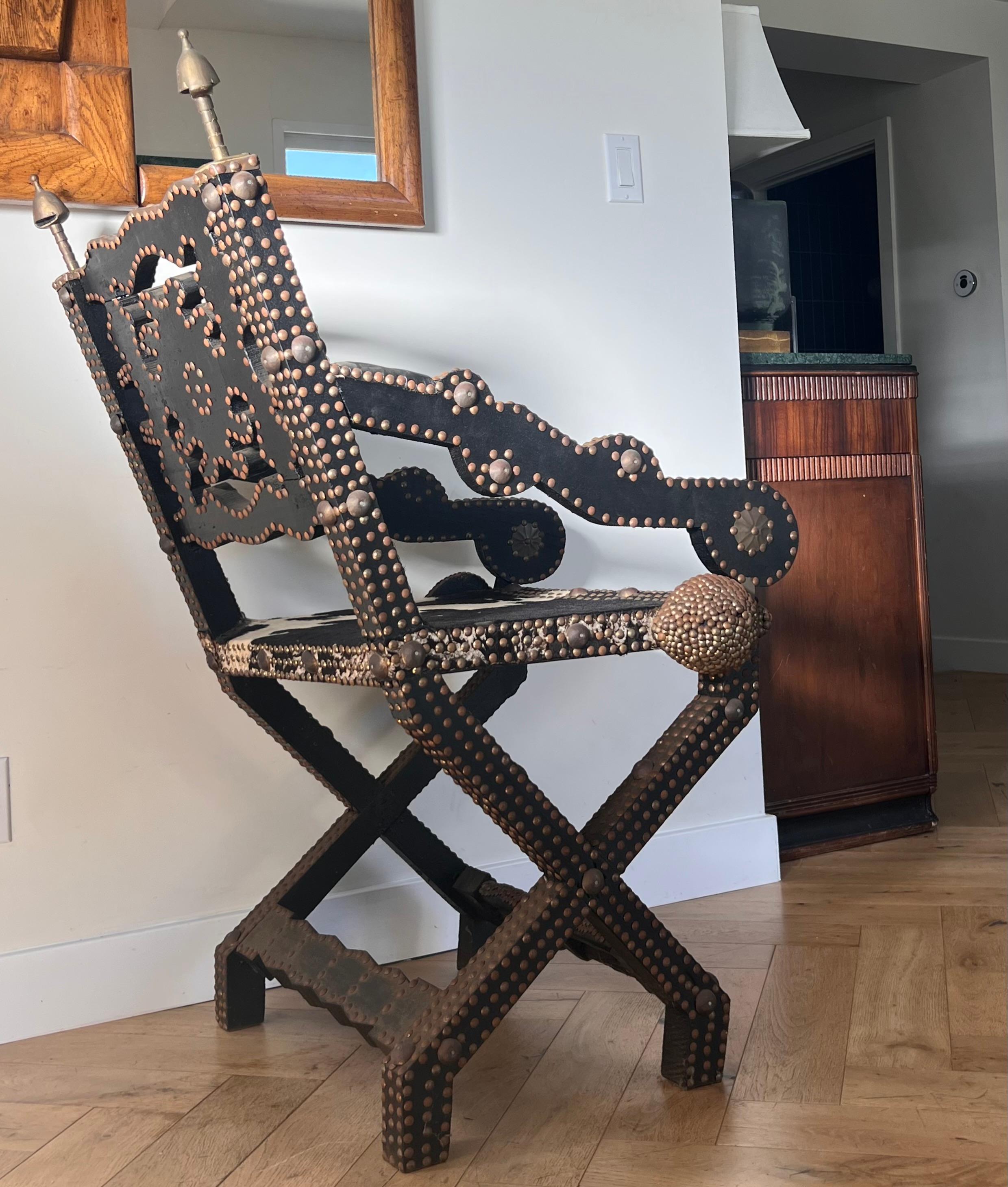 Ghanaian wood, iron, and cowhide chair, early 20th century In Good Condition For Sale In View Park, CA