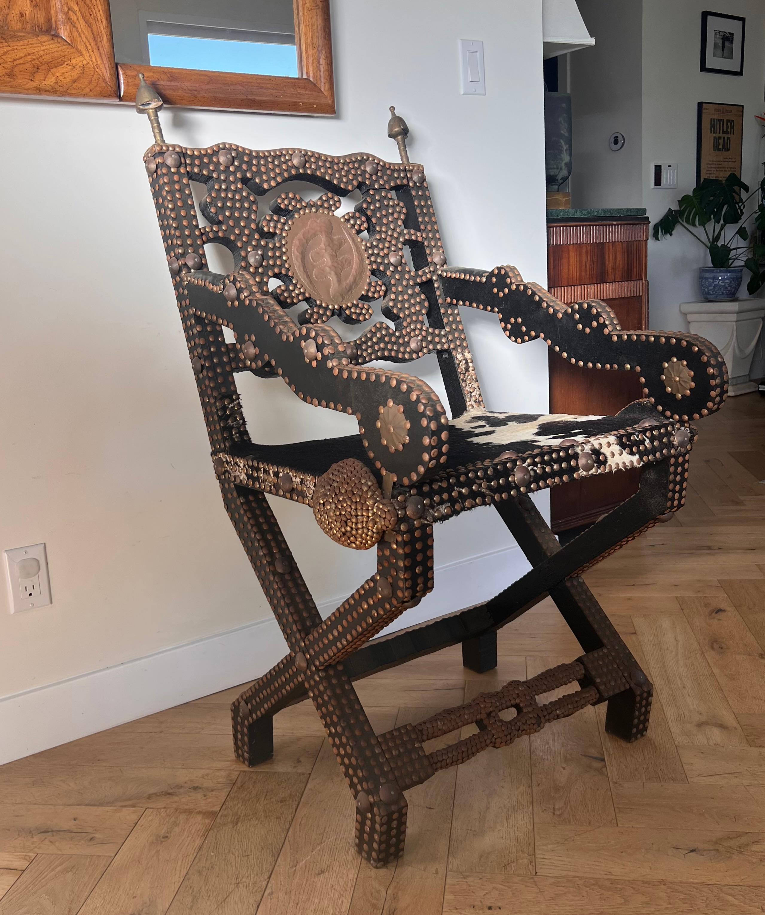 20th Century Ghanaian wood, iron, and cowhide chair, early 20th century For Sale
