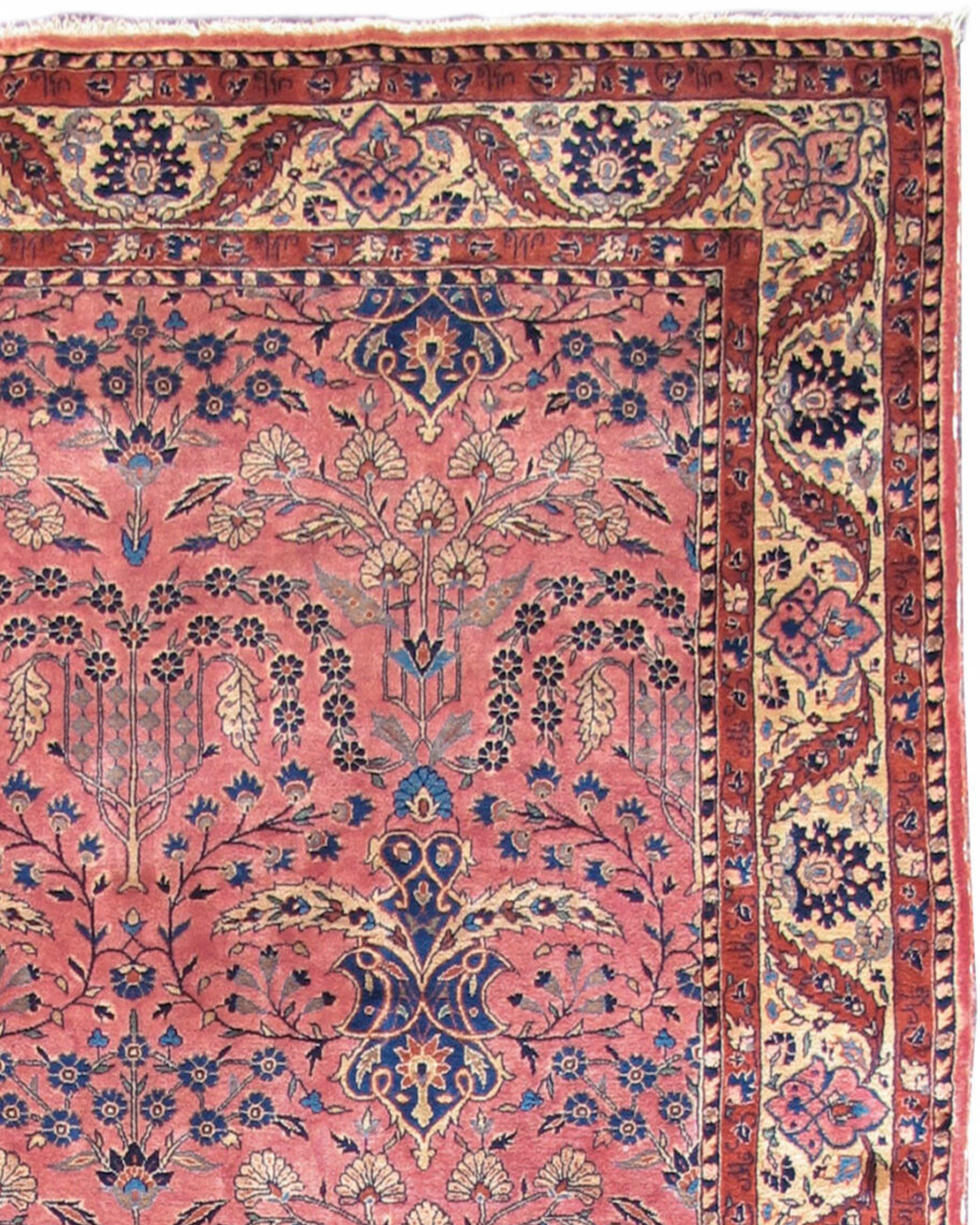 Antique Persian Ghazan Sarouk Rug, c. 1900

Woven with lustrous Manchester wool, this elegant central Persian Ghazan Sarouk rug draws a stylized floral field against a soft rose-red ground. During the early 20th century the soft color palette used