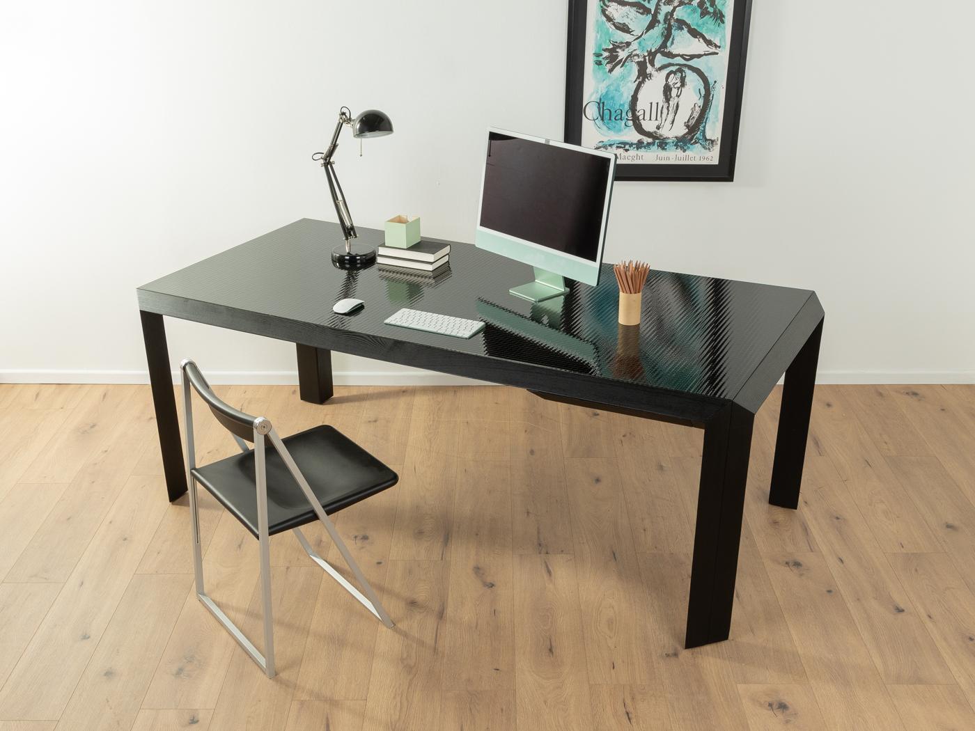 Talete desk/dining table from the 1980s by Pierluigi Ghianda and Gabriele Regondi for Rosenthal. Solid frame in black stained ash with embedded wire glass plate and a drawer for writing utensils.
Table bottom edge 69 cm

Quality Features:
    very