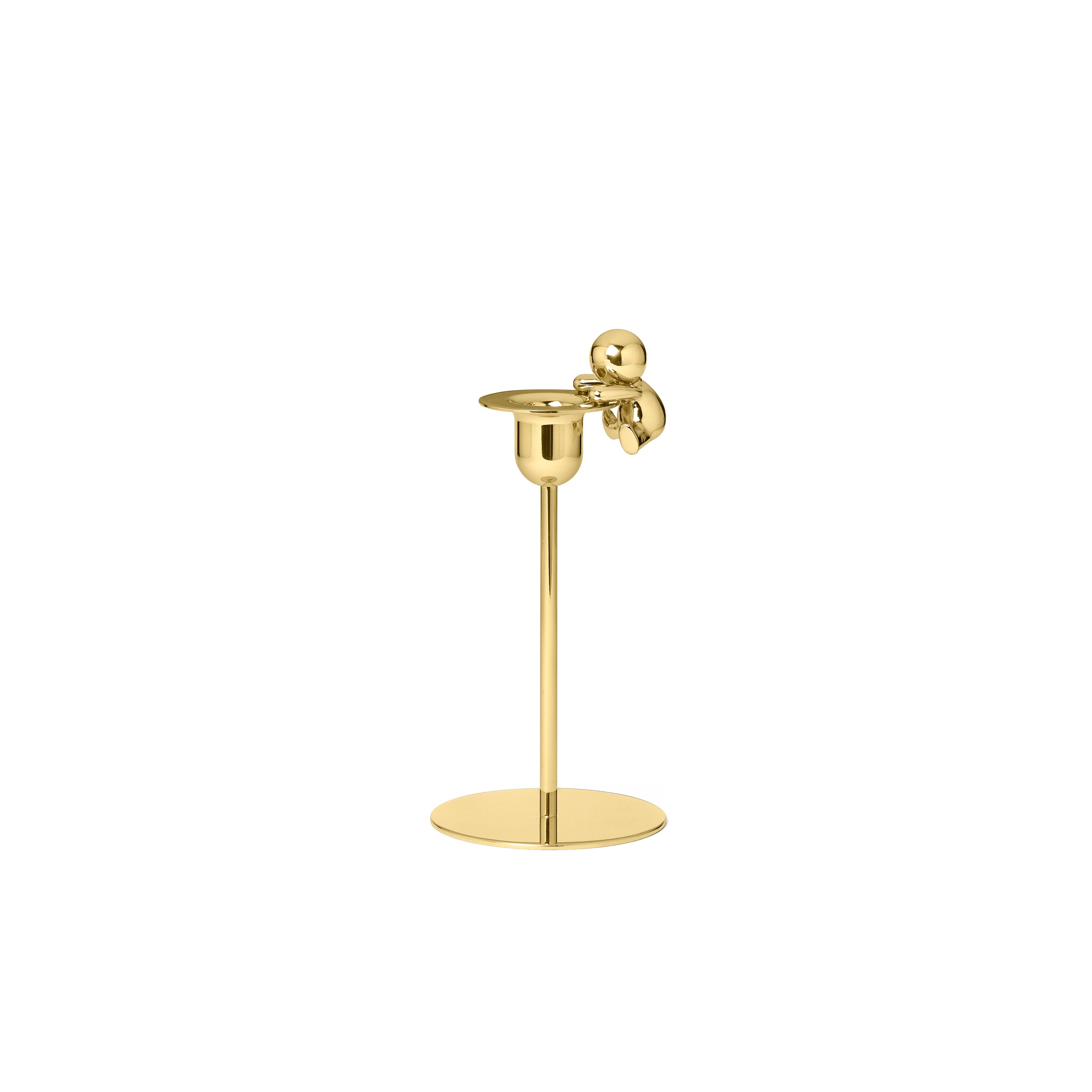 Portacandele in ottone.
Omini è una famiglia di prodotti che gioca sull'inclusione e sul rapporto tra la figura umana e una serie di oggetti monolitici dal design geometrico e minimalista. I piccoli lillipuziani attaccano e animano le forme pure