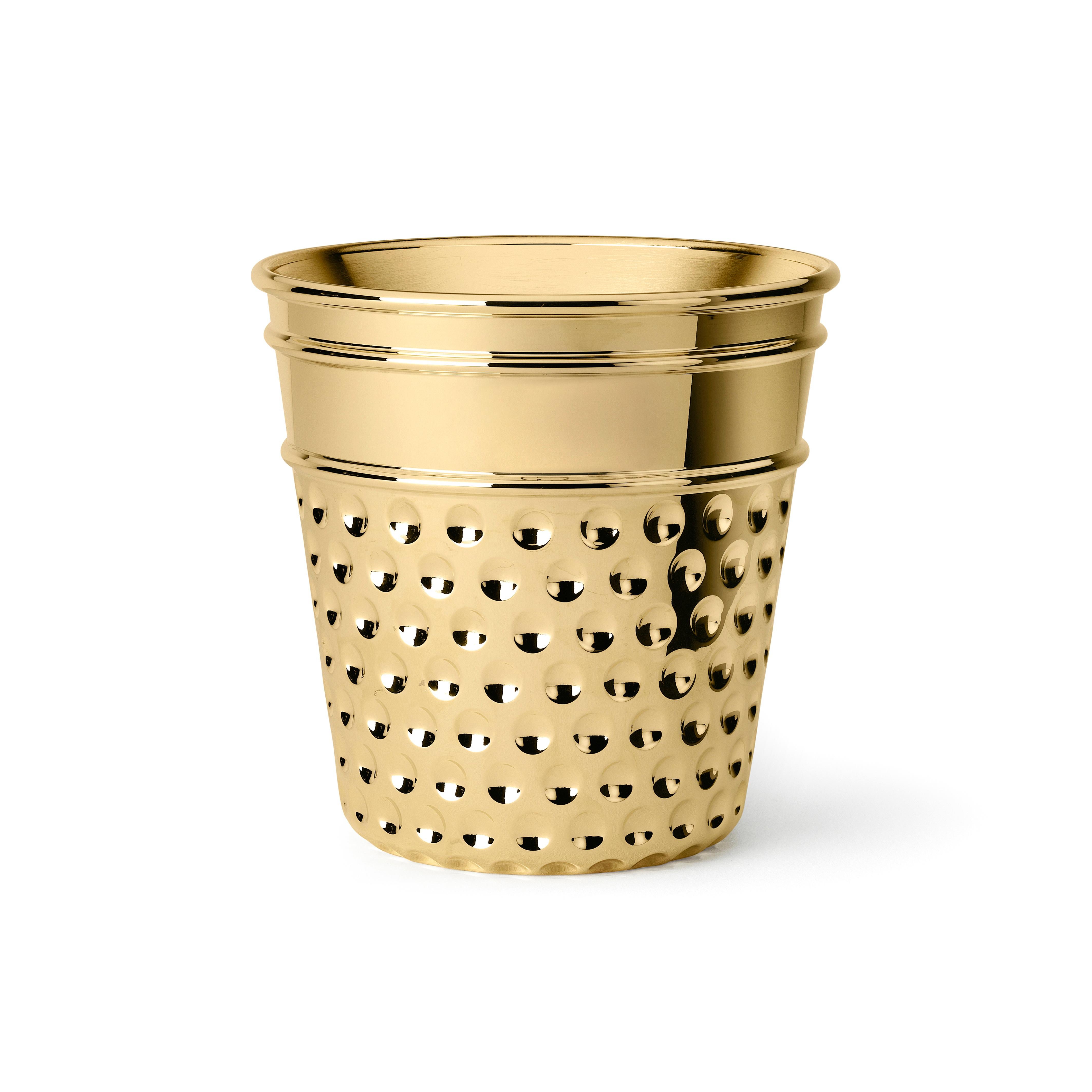 Ice bucket in casted brass. For this supreme ice bucket Studio Job got inspirations by family tailoring traditions and care of the smallest details. The here ice bucket is then represented by a gigantic thimble with etchings.