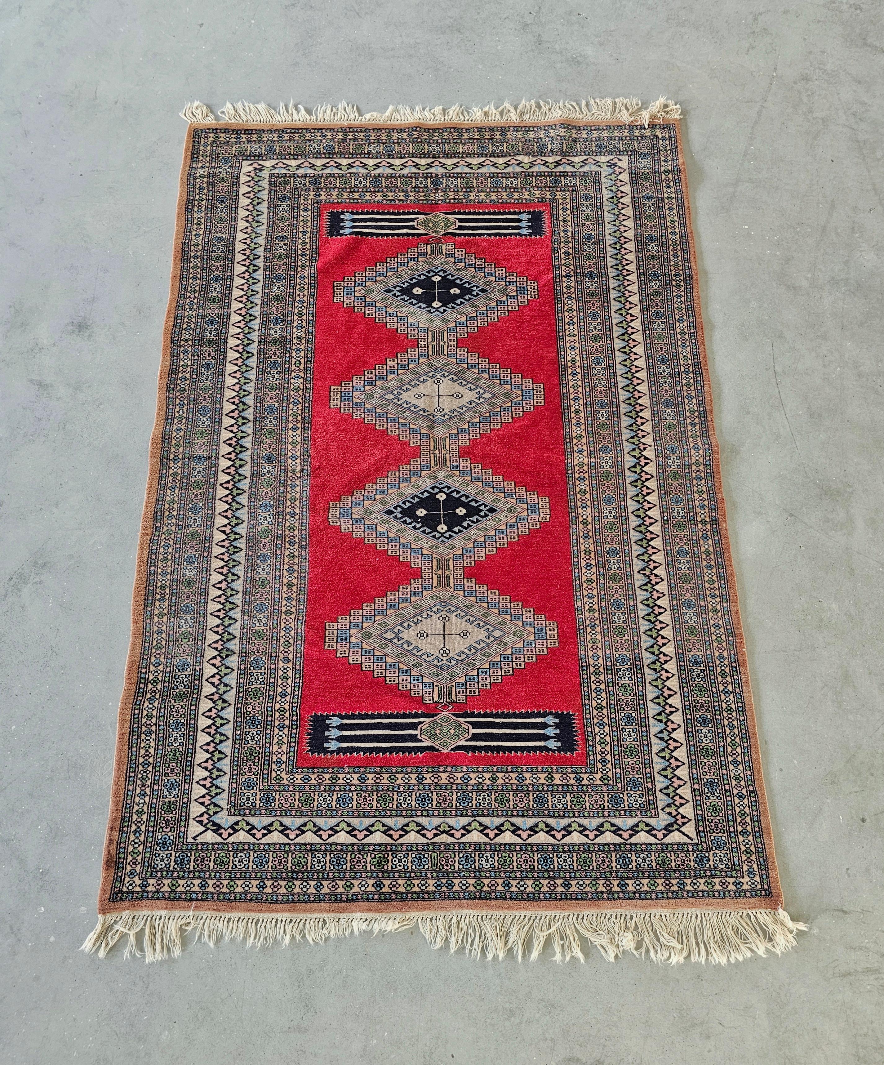 In this listing you will find a gorgeous medium size Persian area rug hand-knotted in 100% fine wool. The rug belongs to Ghom rugs, featuring high density knots. Made in Pakistan in 1930s.

Rug is in very good antique condition with light signs of