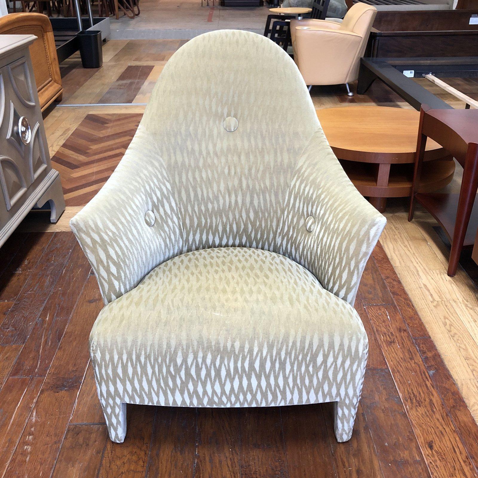 The Ghost chair by Donghia. Graceful lines are punctuated by soft tufted buttons. Striking John Hutton Fabric creates an otherworldly experience in style and comfort.