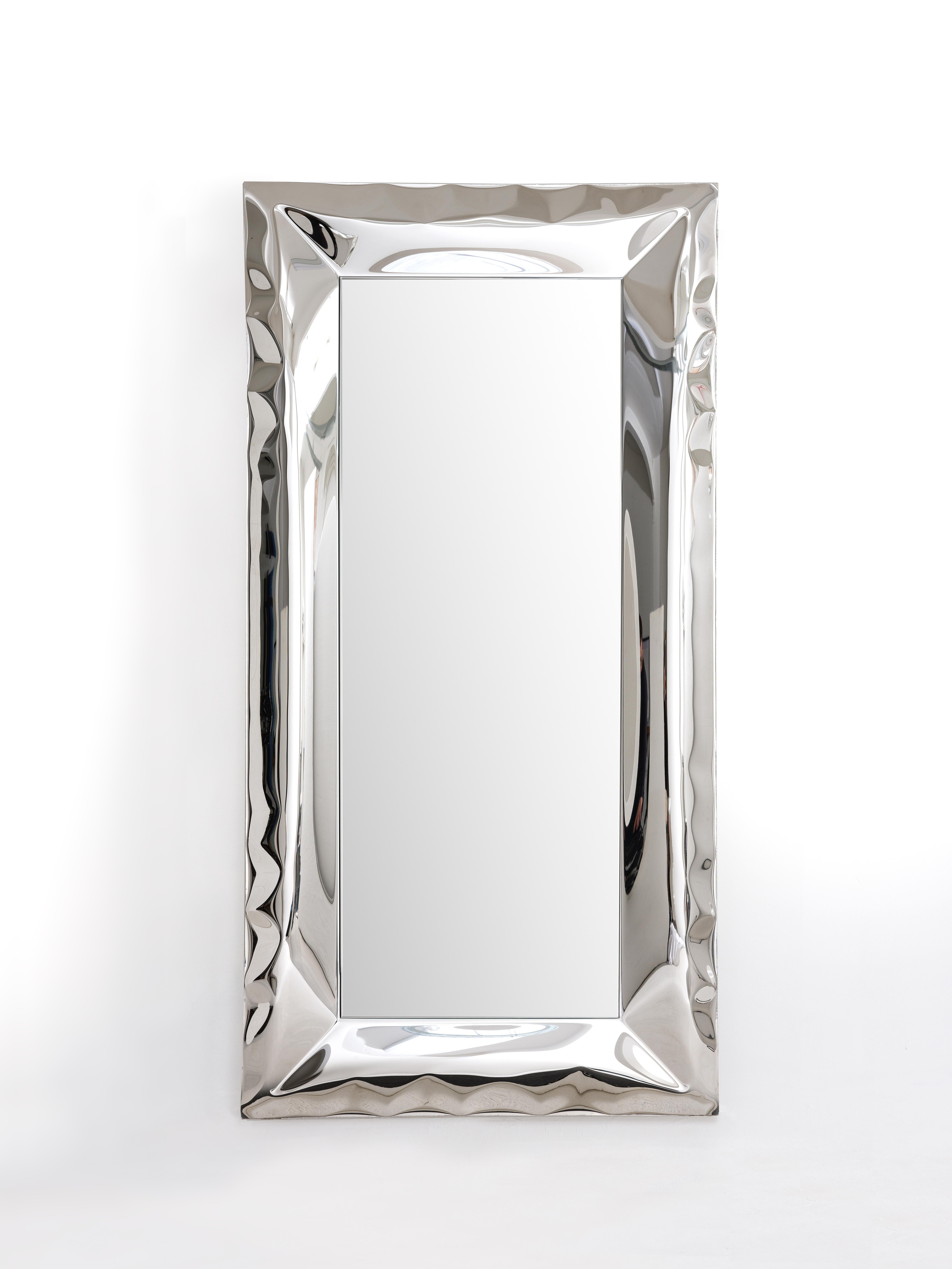 Inflated metal wall mirror. Highly mirror polished stainless steel and 5mm  glass mirror with polished edges.  Each mirror is individually hand formed using our metal inflation process, resulting in a unique and individual piece each time. Each