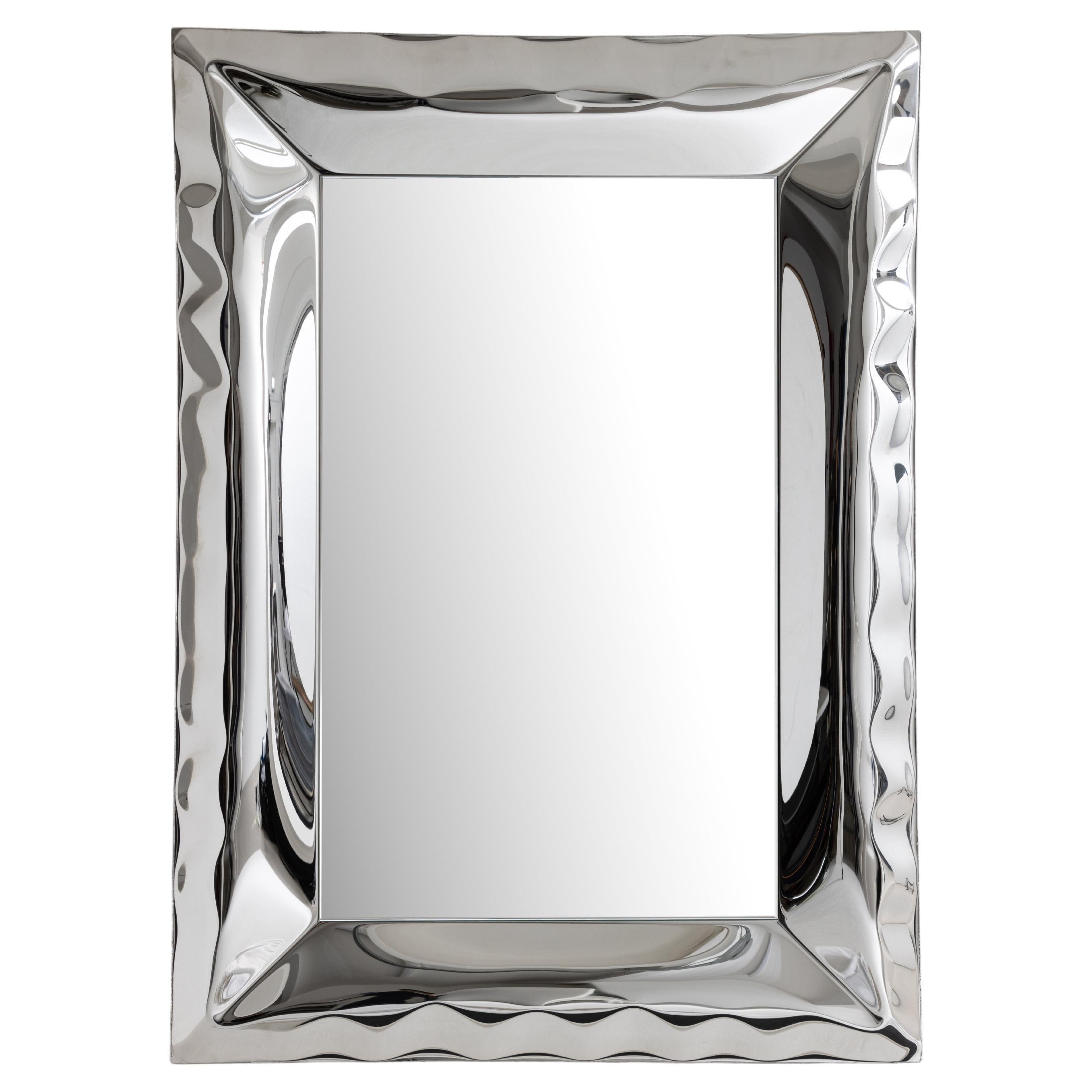 Inflated metal wall mirror. Highly mirror polished stainless steel and 5mm  glass mirror with polished edges.  Each mirror is individually hand formed using our metal inflation process, resulting in a unique and individual piece each time. Each