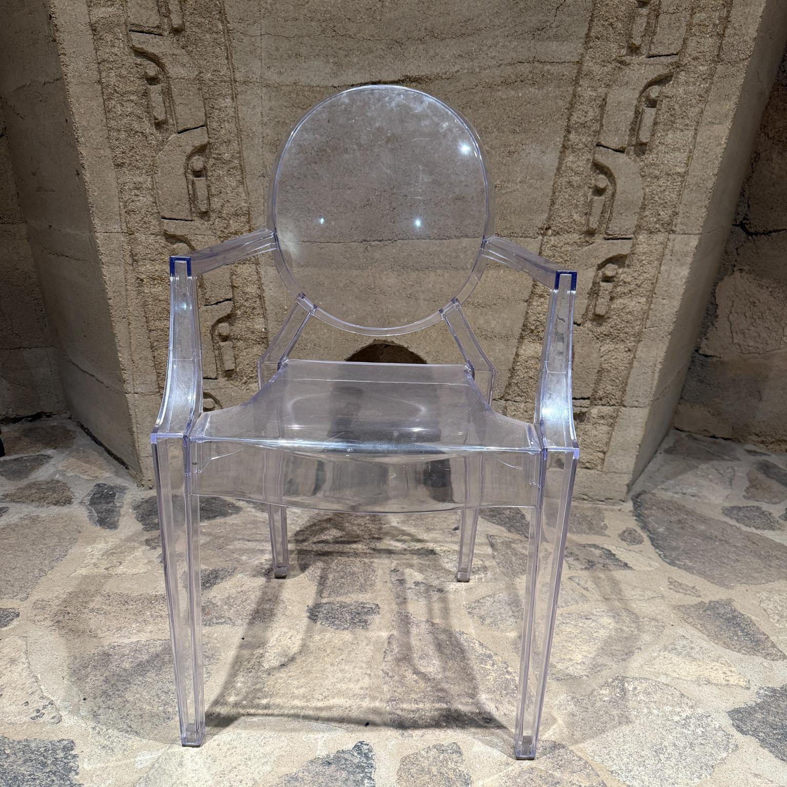 For your consideration a Ghost lucite chair. Hard translucent plastic. No label or marking present from the maker. 

Dimensions: 35.25 H x 21.13 W x 17.25 D . Seat 18.75 H, arm rest 26.5 H

Delivery within 200 miles from San Diego CA is available