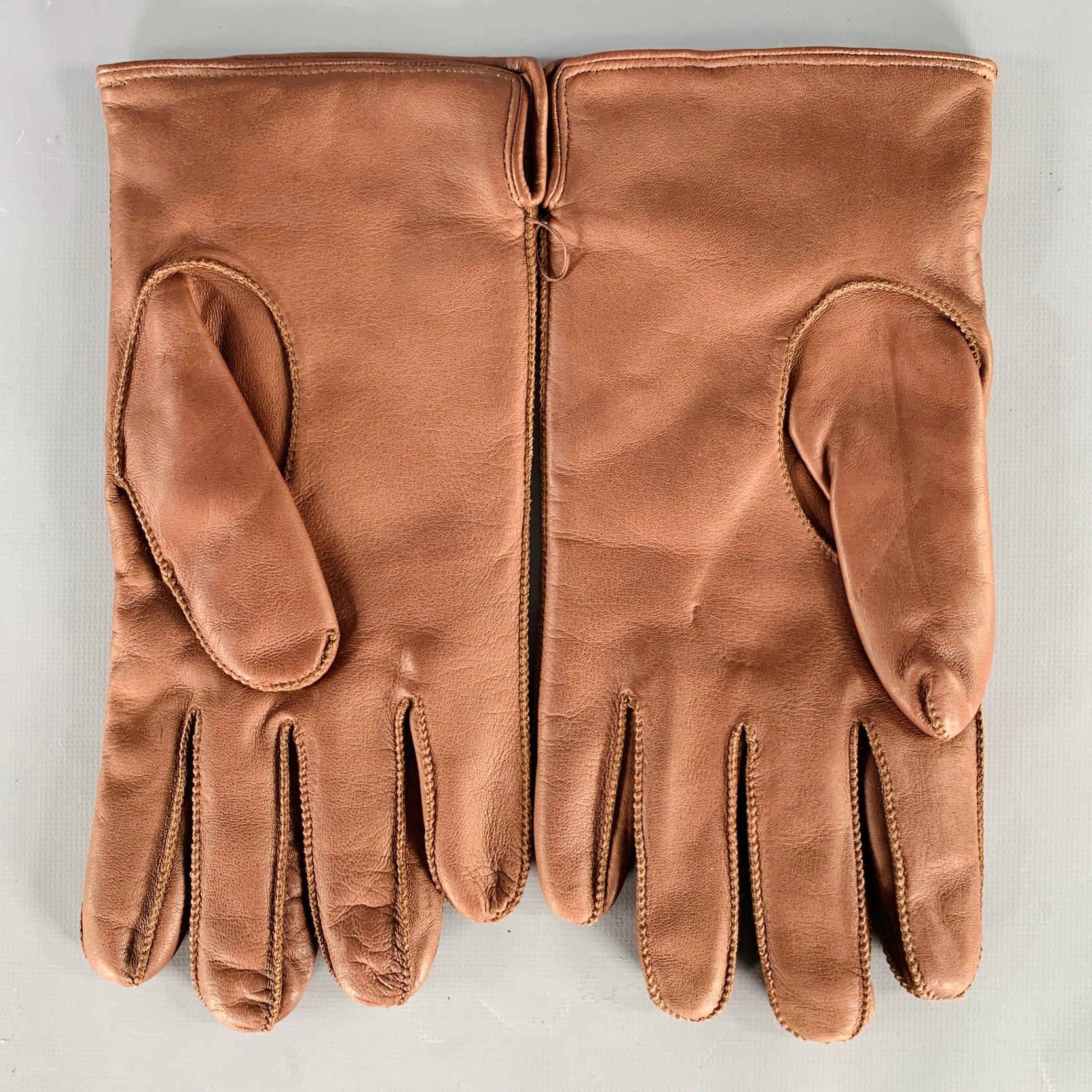 GHURKA gloves
in a buttery soft brown leather (feels like lambskin) featuring cozy cashmere lining.Excellent Pre-Owned Condition. 

Marked:   S 

Measurements: 
  Width: 4.5 inches Length: 10 inches 
  
  
 
Sui Generis Reference: 135385
Category: