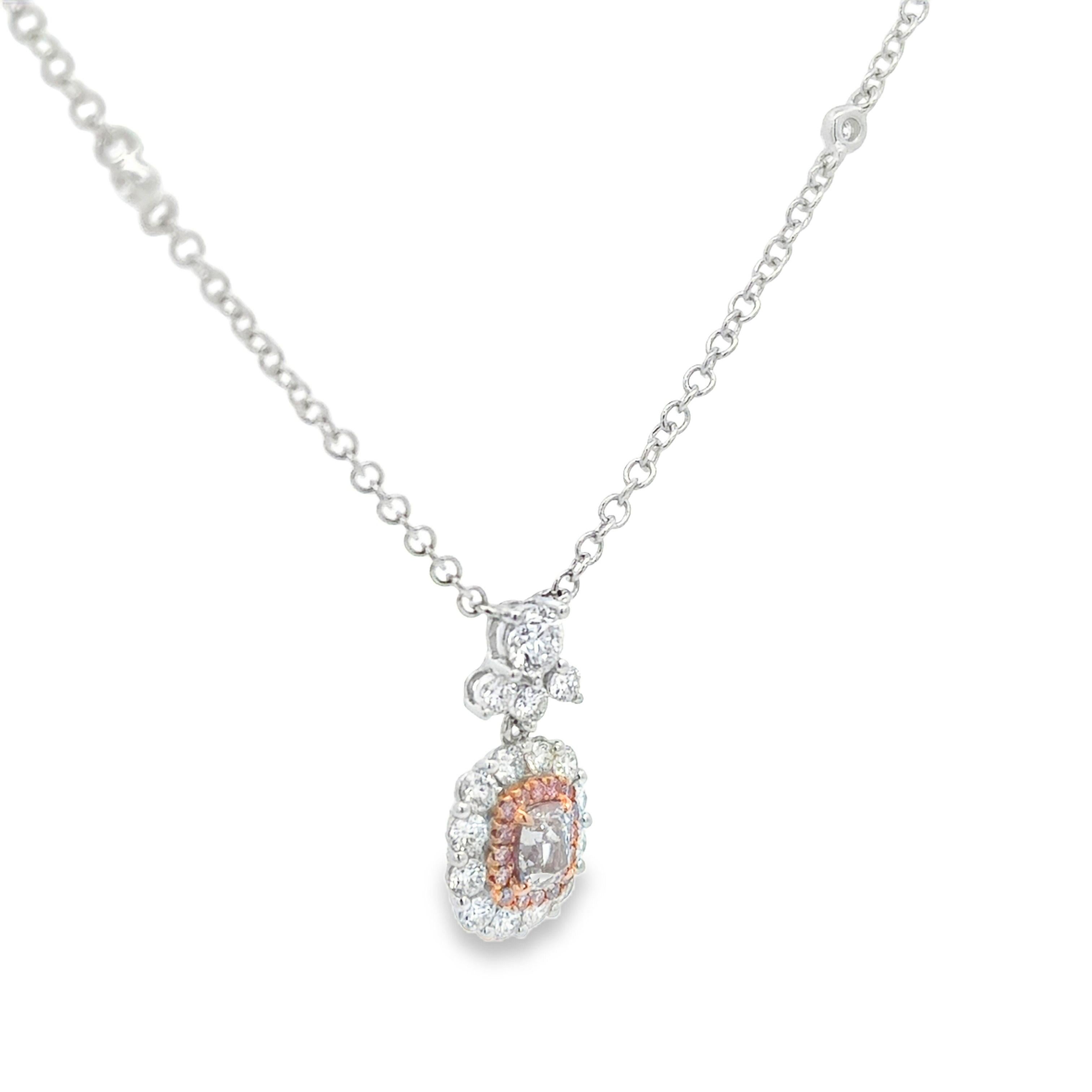 A beautiful pendant necklace, featuring a 0.40 carat cushion cut diamond certified by GIA as natural with Light Pink color and VS2 clarity, set on a four claw prong setting. Surrounded by a halo of round cut pink diamonds weighing 0.07 carat total.