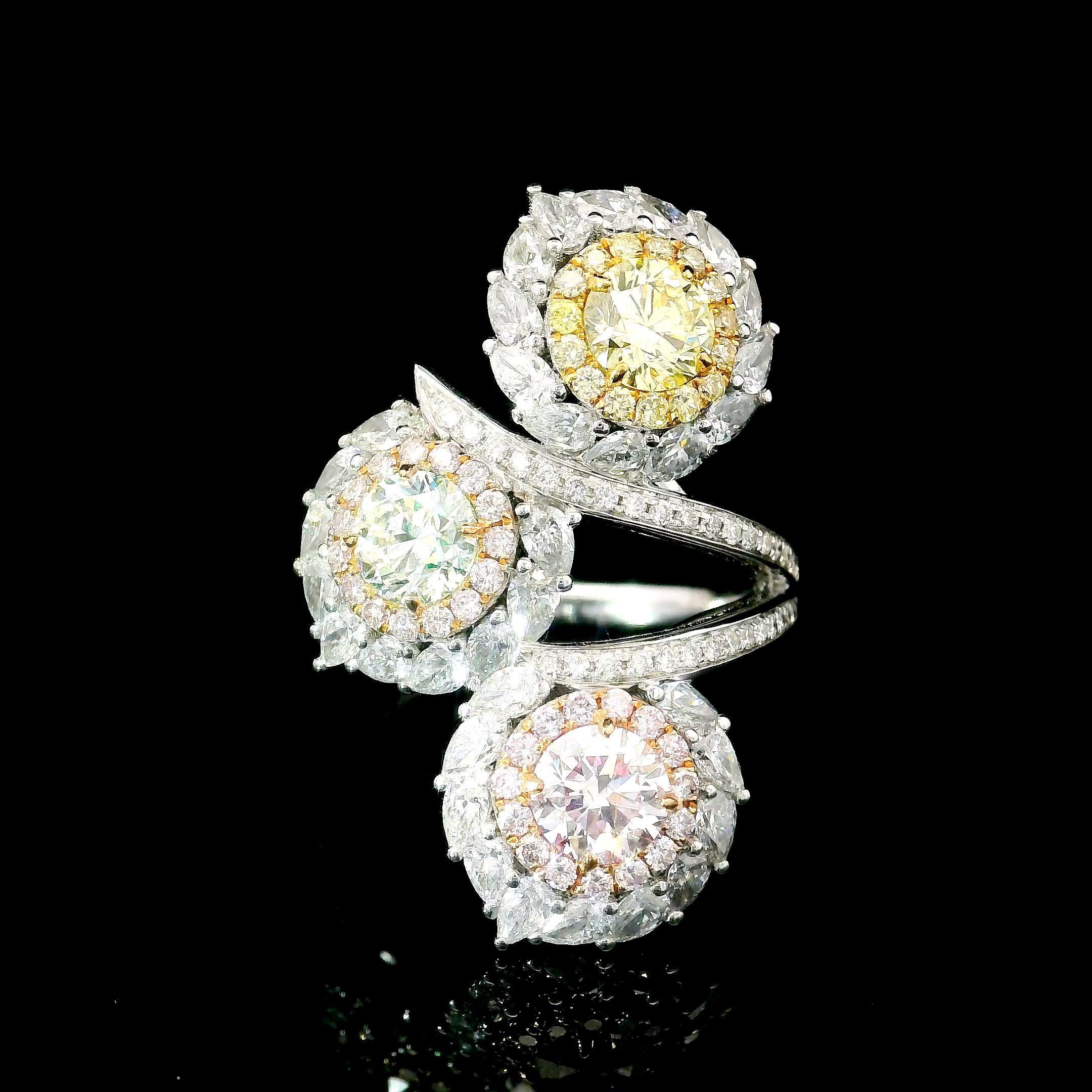 18kt white gold ring with diamonds
  
  Gold colour & karat: White gold 18kt
  Weight: 7.92 grams
  
  Set with-
1) Stone type: Diamonds
  Shape: Round
  Carat: 0.50
  Colour: Faint Pinkish Brown  
  Clarity: VS1

2) Stone type: Diamonds
  Shape:
