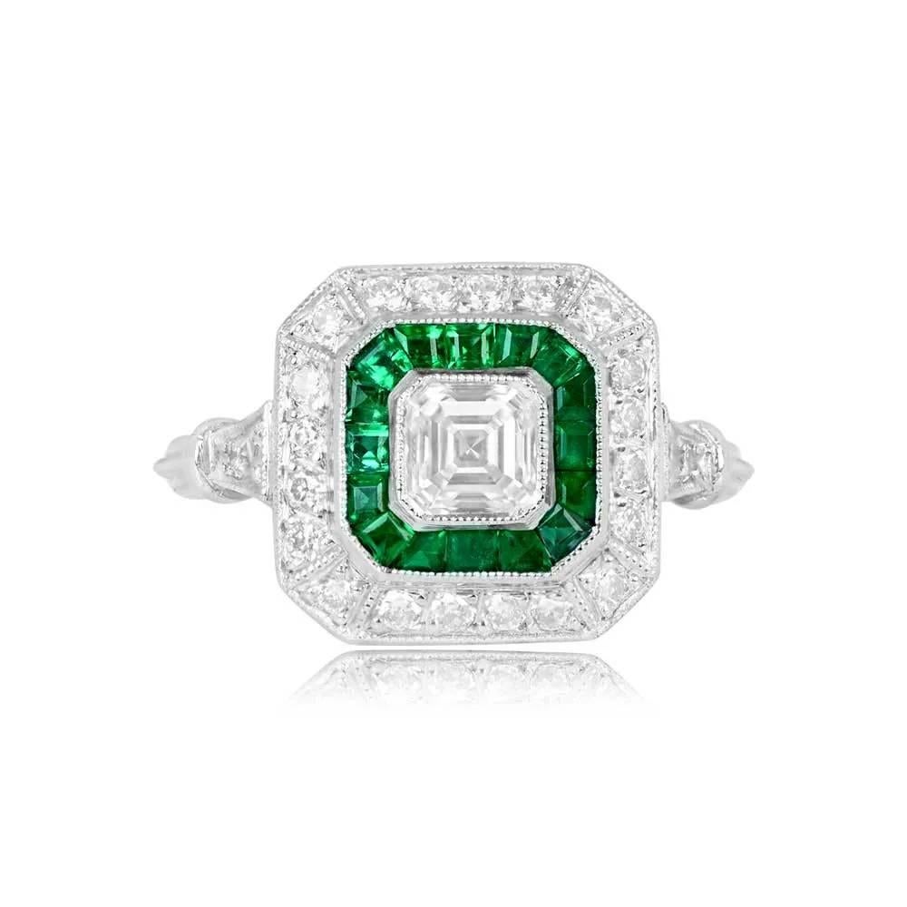 A geometric ring featuring a GIA-certified 0.52-carat Asscher cut diamond, H color, and VS1 clarity. The center diamond is bezel-set, surrounded by a double halo of calibre natural green emeralds and old European cut diamonds. Additional old