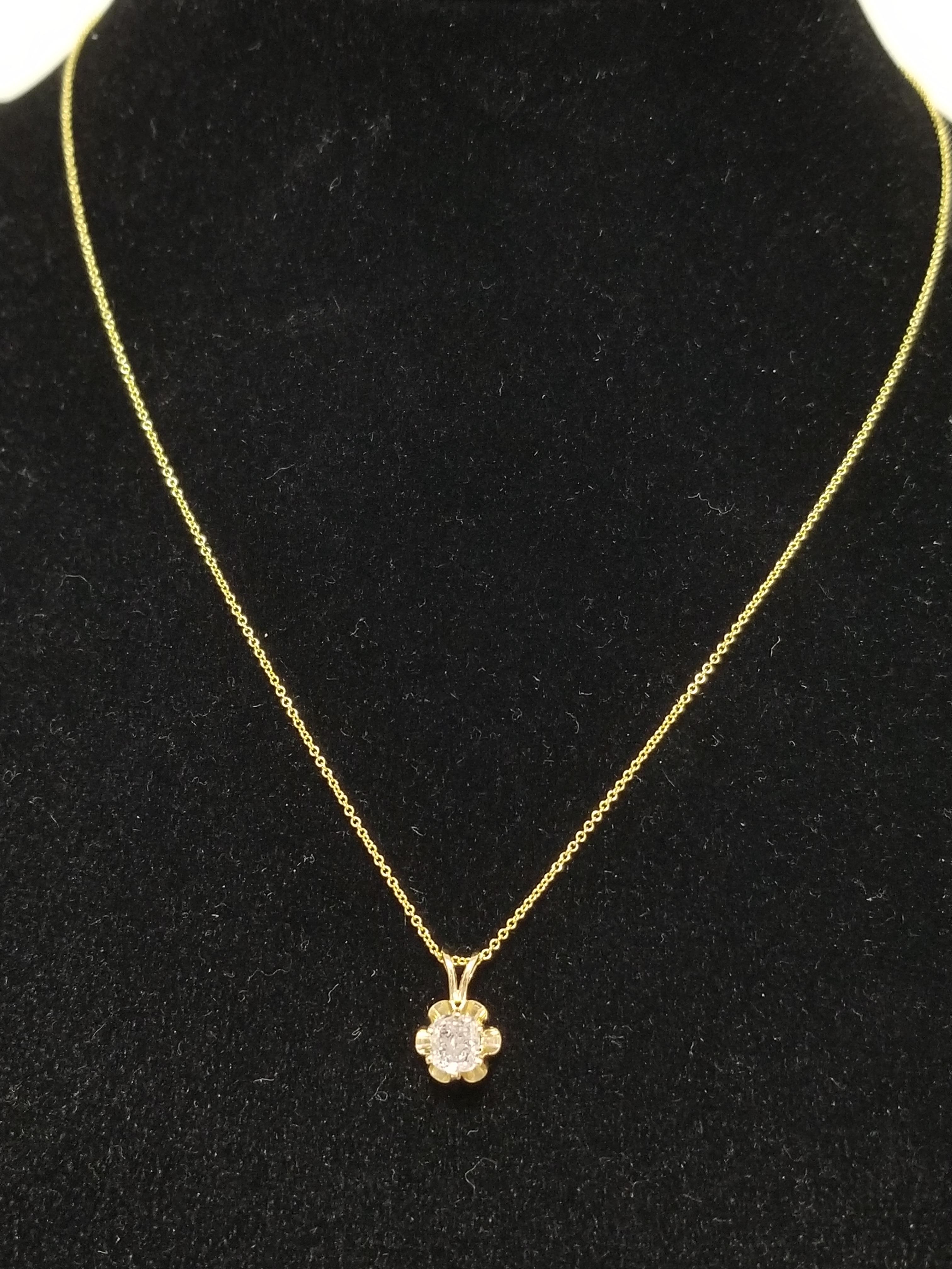 This gorgeous diamond pendant features a 0.53 carat GIA pink cushion diamond solitaire set in a beautiful 14 karat yellow gold buttercup design. Pendant measures approximately 0.5 inch length and 0.25 inch wide. 

(Pendant Only-Chain sold
