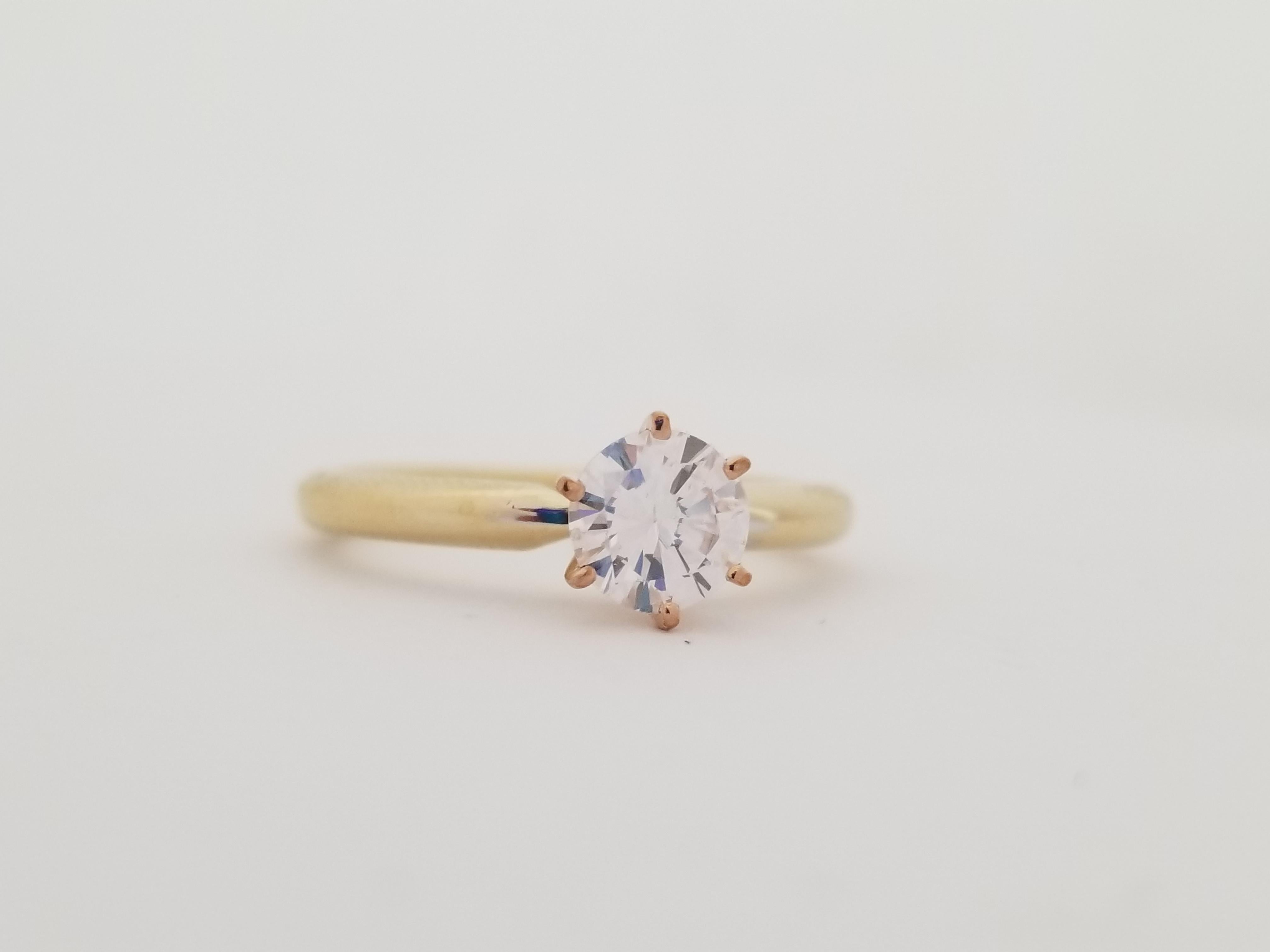 GIA Faint Pink 0.59 Carats natural diamond set on a 6 prong yellow gold 14 Karat Ring. Sparkling, Shiny. Ring Size 6
