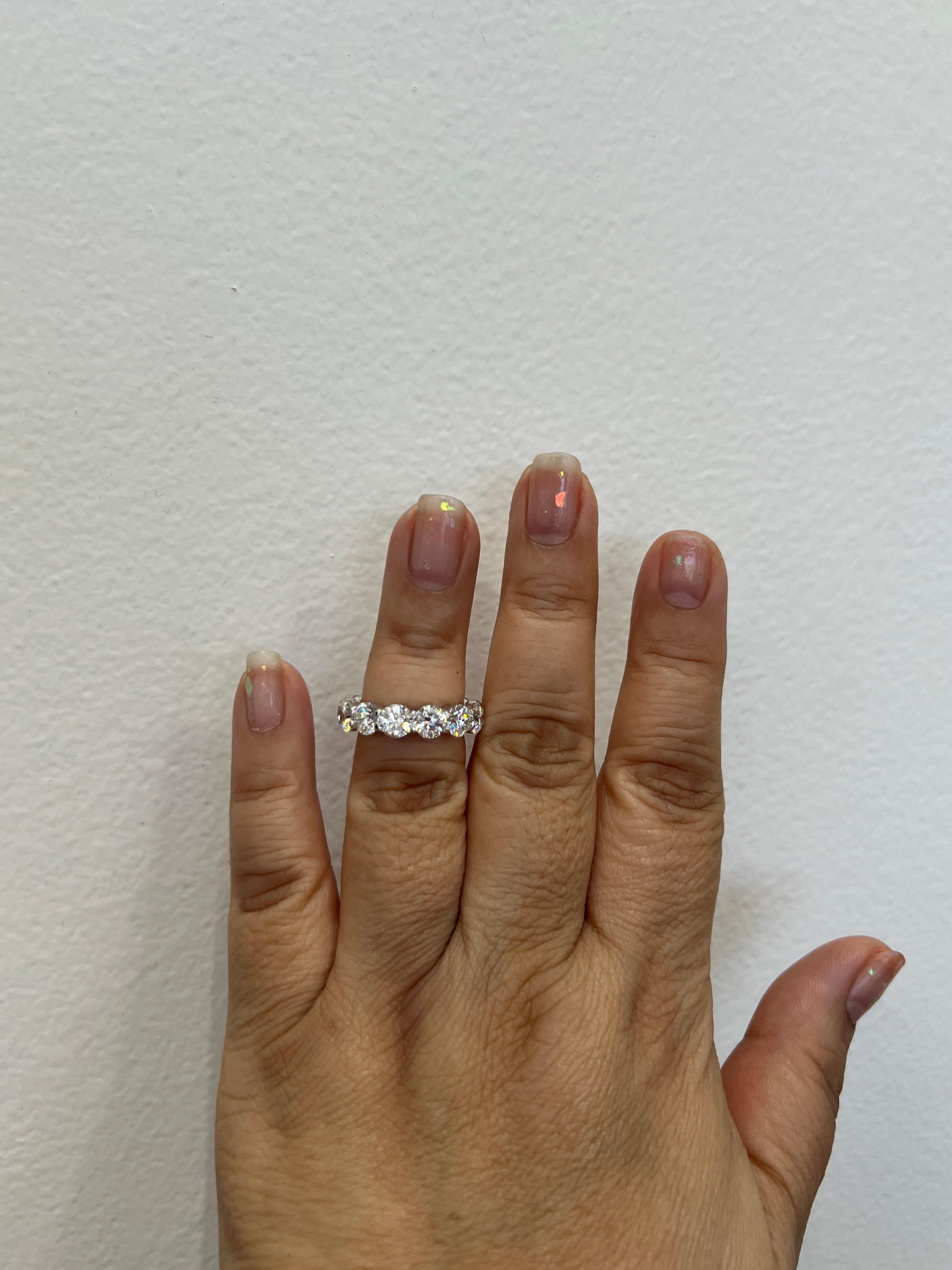 Beautiful 7.82 ct. IJ SI white diamond rounds.  Total of 13 stones, each one is 0.60 ct.  Ring size 6.5.  Each stone comes with a GIA certificate.  Handmade in 18k white gold.